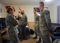 MINOT AIR FORCE BASE, N.D. -- Maj. Gen. C. Donald Alston, 20th Air Force commander, and Chief Master Sgt. Tammy S. Elliott, 20th Air Force command chief, visits the dorm room of Airman 1st Class Dustin Milnes, 91st Missile Security Forces Squadron response force leader, and Airman 1st Class Greg Harris, 5th Security Forces Squadron response force member, to experience what life is like for Airmen who live in a double occupancy room here Nov 30. General Alston and Chief Elliott visited with the men and women of the 5th Bomb Wing and 91st Missile Wing to experience what their quality of life is like during the winter months and to ensure they have the resources available to complete their Air Force Global Strike Command mission. (U.S. Air Force photo/Staff Sgt. Keith Ballard)