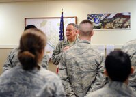 MINOT AIR FORCE BASE, N.D. -- Maj. Gen. C. Donald Alston, 20th Air Force commander, visits with the men and women of the 91st Missile Wing Security Forces Group at their guard mount before they begin the trip out to the missile alert facilities here Dec. 1. General Alston visited the 91st Missile Wing to experience what their quality of life is like during the winter months and to ensure they have the resources available to complete their Air Force Global Strike Command mission. (U.S. Air Force photo/Staff Sgt. Keith Ballard)