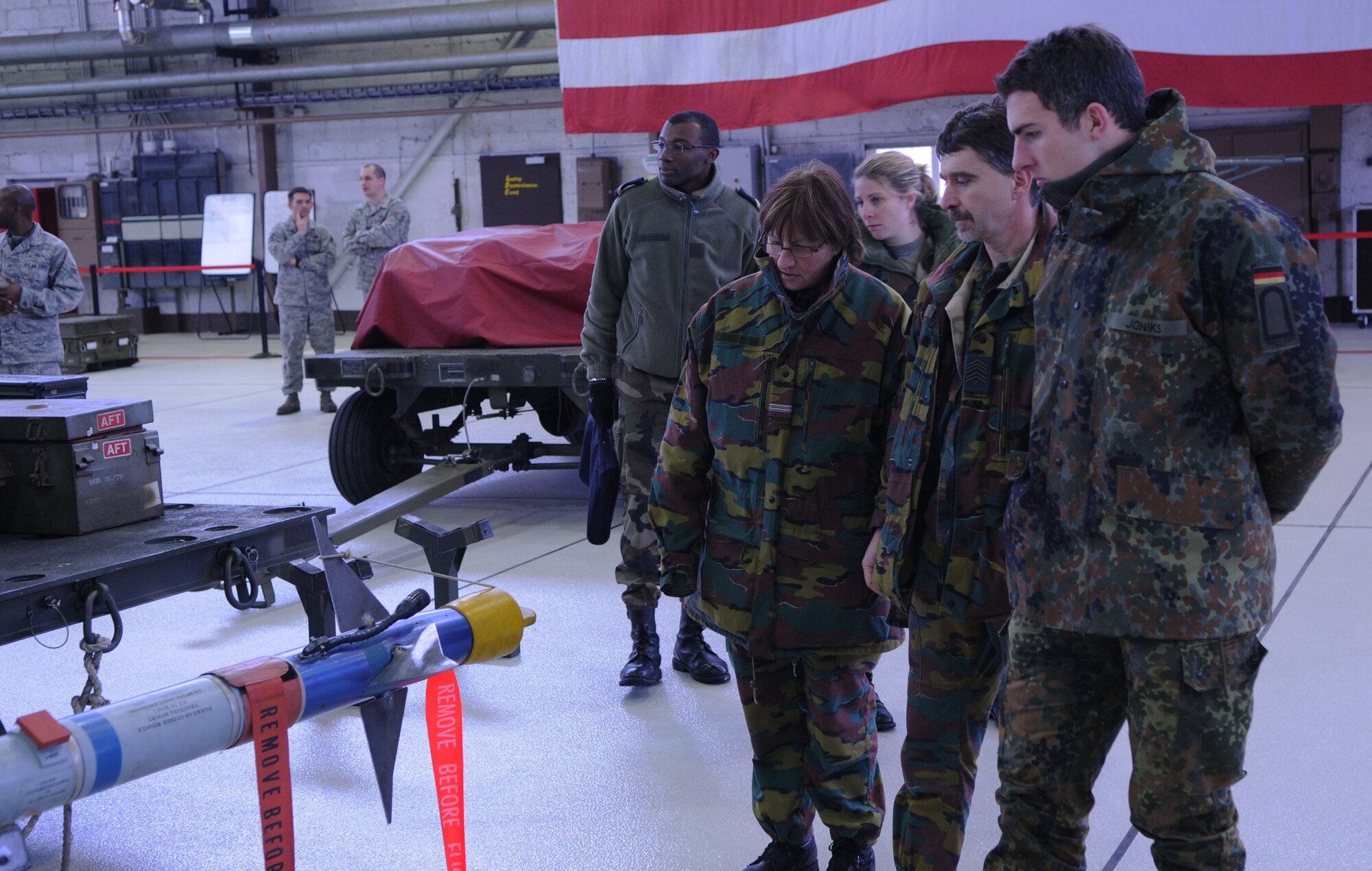 SPANGDAHLEM AIR BASE, Germany – Belgian air force Cpl. Lucienne Michaux, Belgian Warrant Officer Pascal Otoul, and German air force Staff Sgt. Alexander Joniks during a NATO visit Dec. 2. Members of NATO Headquarters Allied Air Command at Ramstein Air Base, Germany, visited the 52nd Fighter Wing to familiarize themselves with an American fighter wing and how it operates. (U.S. Air Force photo/Airman 1st Class Matthew B. Fredericks)
