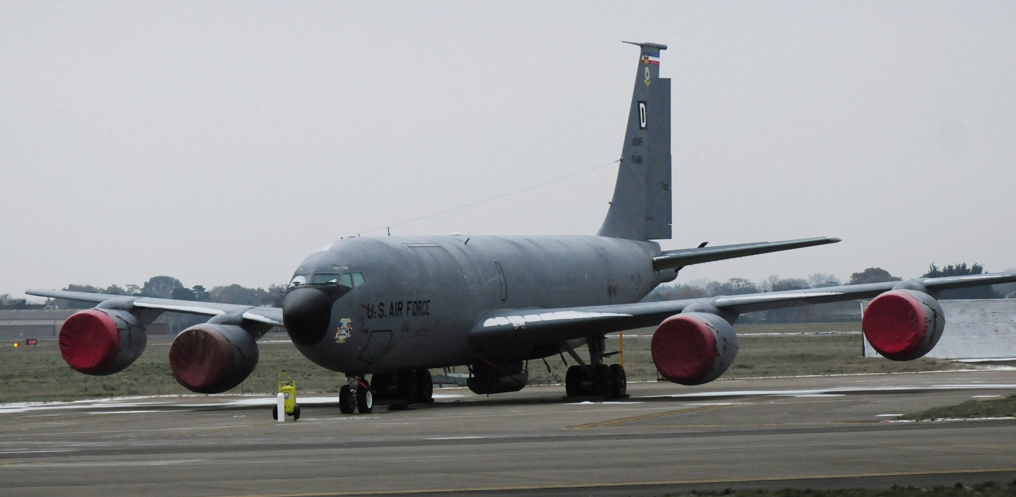 RAF MILDENHALL, England -- One of RAF Mildenhall's KC-135 Stratotankers sits sprinkled in snow, waiting to be deiced, Dec. 3, 2010. Because of the current winter conditions, personnel from the 100th Aircraft Maintenance Squadron have to deice aircraft before takeoff to ensure they launch and land safely. Engine covers must be fitted before the plane can be deiced, so chemicals don't get into the engine, as it can cause serious damage. (U.S. Air Force photo/Karen Abeyasekere)