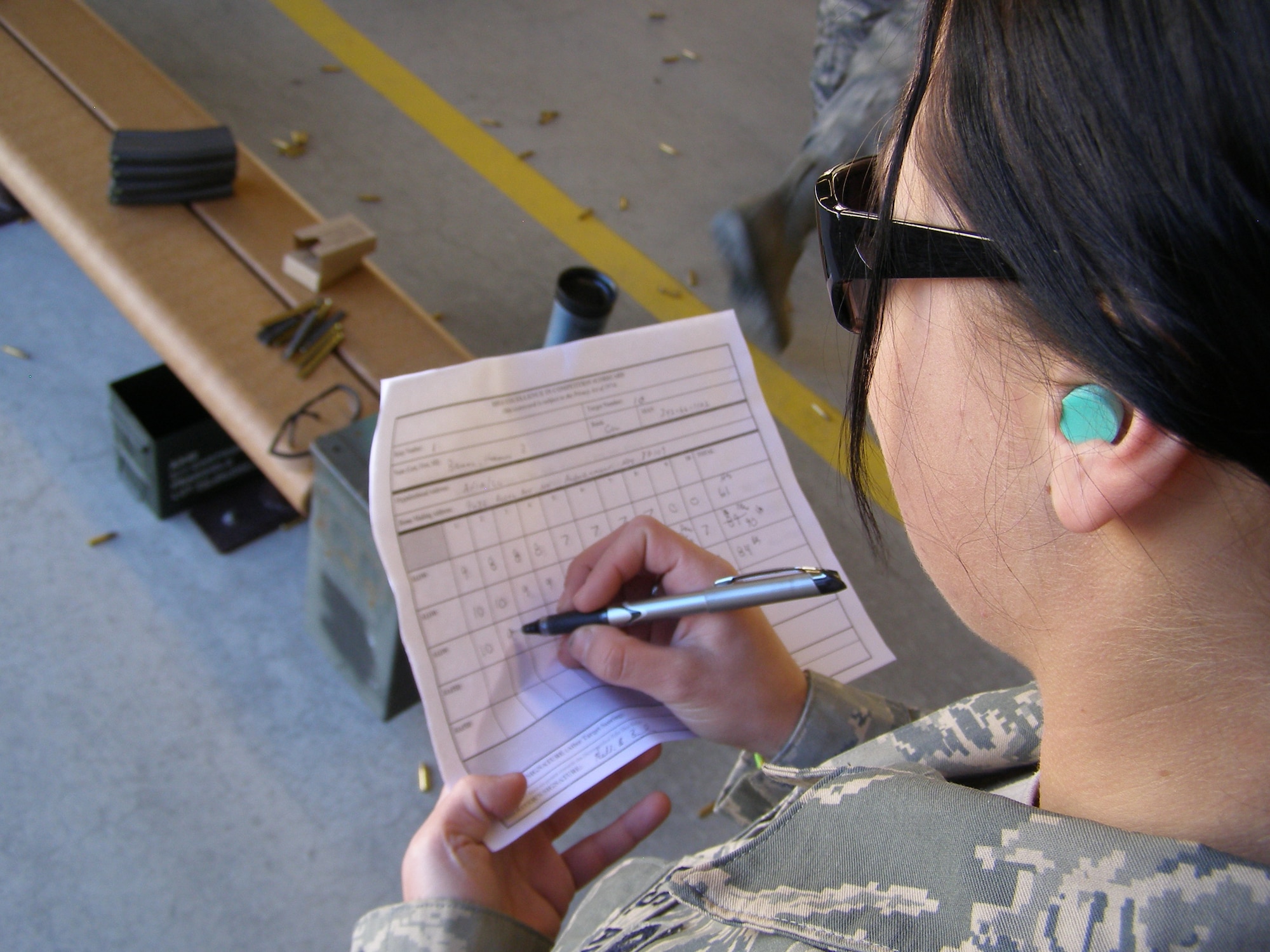 Airman 1st Class Tiffany Westgate, 377th Security Forces Squadron, checks her score. Courtesy Photo
