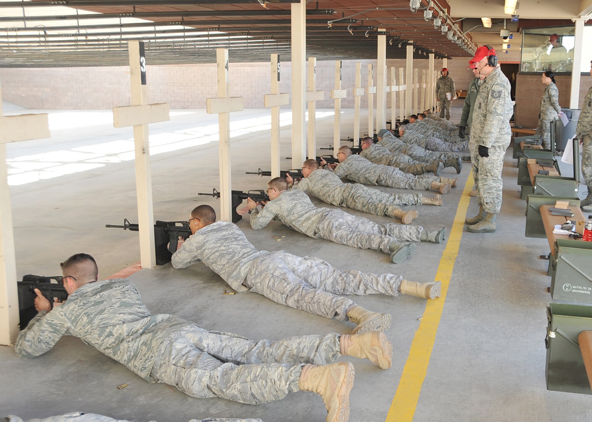 Range officials observe as competitors engage their targets.  U.S. Air Force Photo by Todd Berenger.