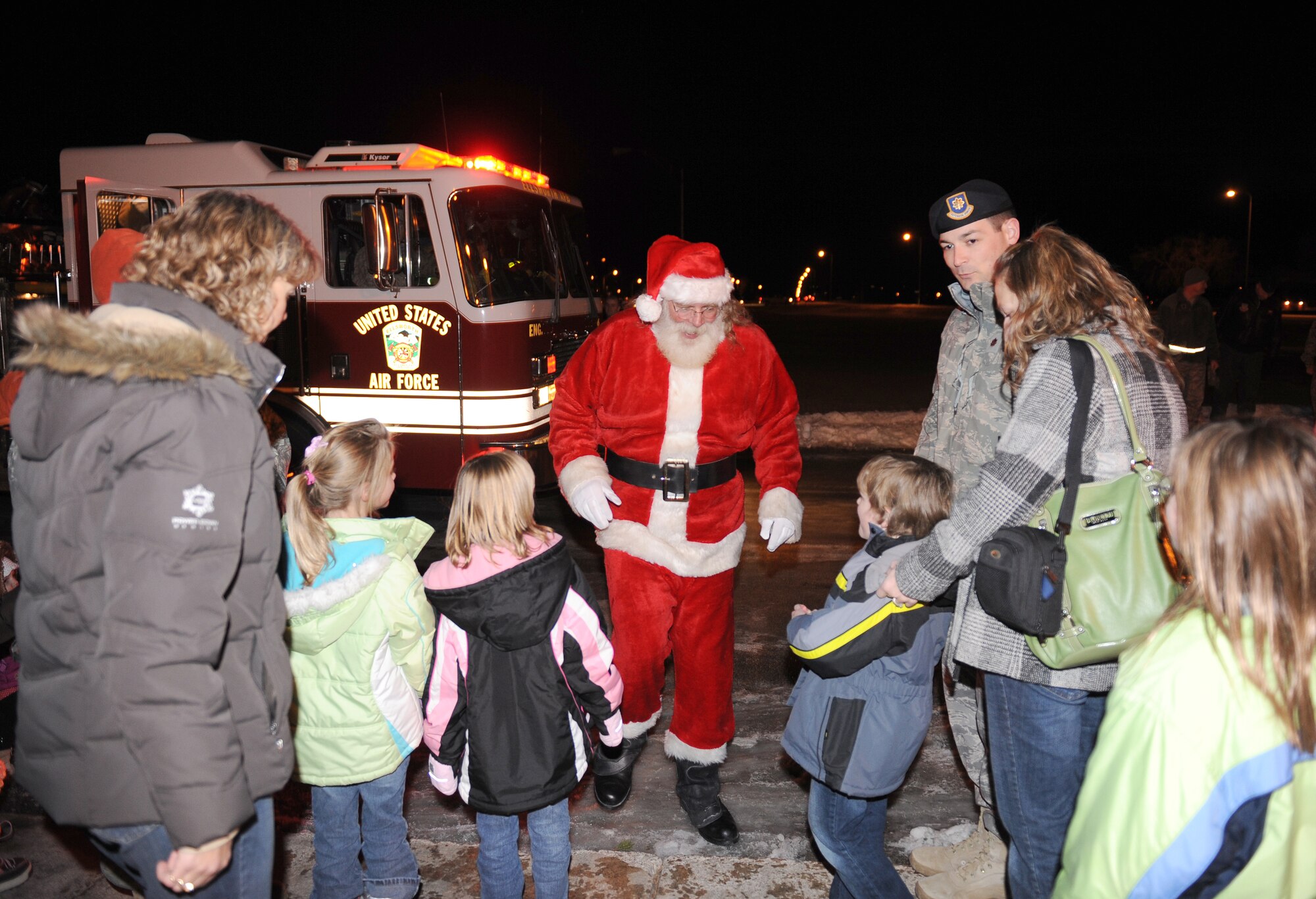 ELLSWORTH AIR FORCE BASE, S.D. -- Santa Claus arrives at the base Christmas Tree Lighting ceremony, Dec. 1 at the Freedom Chapel. The ceremony was hosted by the base chapel and had several holiday activities including Christmas carol singing and lighting the base Christmas tree. (U.S. Air Force photo/Master Sgt. Loren J. Bonser)