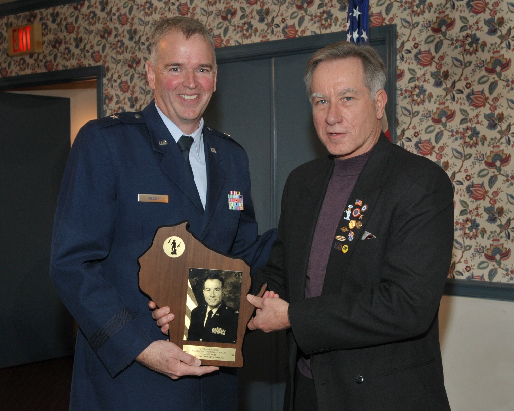 Col (ret) Dennis Malone receives his induction plaque from Brig Gen John McCoy, Deputy Adjutant General for Air, State of Wisconsin. The induction ceremony took place at Klemmer's Banquet Hall here in Milwaukee, Wisconsin on 24 November 2010.
Col. (ret.) Malone’s career spanned 36 years, serving the last twelve years as the Mission Support Group Commander of the 128th Air Refueling Wing in Milwaukee.
(USAF Photo by: SMSgt Jeff Rohloff)