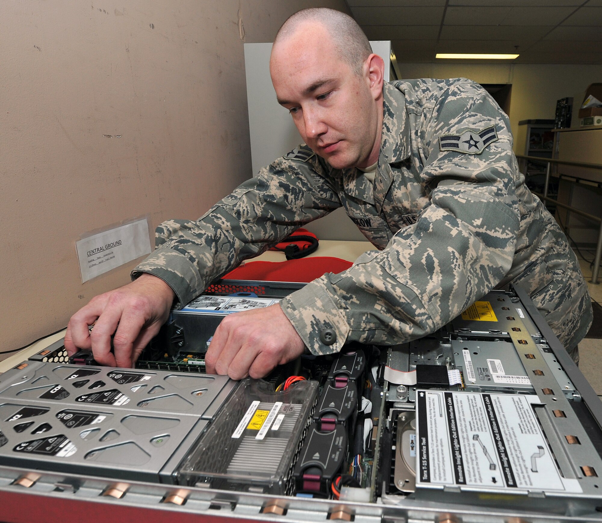 Airman 1st Class Jay Winslow, a 19th Communication Squadron cyber systems operator, upgrades memory on a server in the network control center Nov. 29, 2010, at Little Rock Air Force Base, Ark. The network control center operates more than 70 servers covering all base personnel. (U.S. Air Force photo by Staff Sgt. Chris Willis)