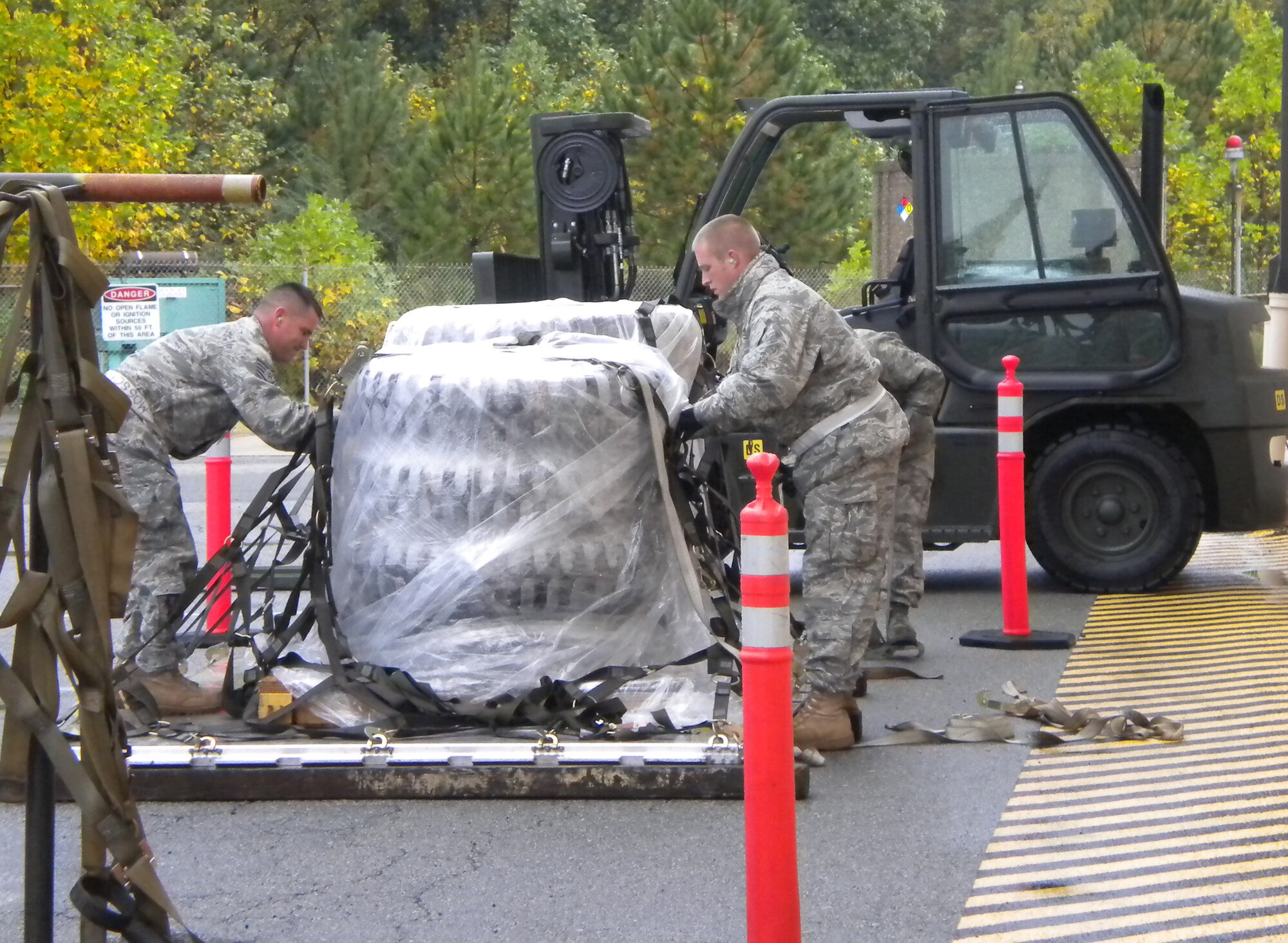 Tech. Sgt. Richard Mosser, left, and Tech. Sgt. Christopher Scott take part in the Palletizing Cargo event during the Port Dawg Challenge. This was one of 11 events the Steel City Port Dawgs competed in. The 32nd Aerial Port Squdron placed second overall at the Port Dawg competition.