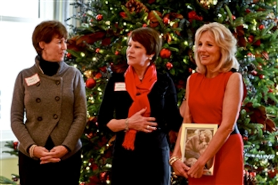 Cheryl McKinley, center, wife of Air Force Gen. Craig McKinley, chief of the National Guard Bureau, talks about the role of the Guard at a holiday event for children hosted by Dr. Jill Biden, right, wife of Vice President Joe Biden, at their home at the Naval Observatory in Washington, D.C., Dec. 1, 2010. Sheila Casey, left, wife of Army Chief of Staff Gen. George W. Casey Jr., also discussed the importance of supporting military families during the holidays.