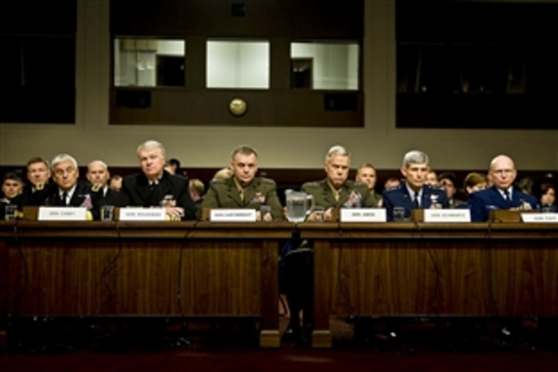 From left, Army Chief of Staff Gen. George W. Casey Jr., Chief of Naval Operations Adm. Gary Roughead, Joint Chiefs Vice Chairman Marine Corps Gen. James E. Cartwright, Marine Corps Commandant Gen. James F. Amos, Air Force Chief of Staff Gen. Norton A. Schwartz, and Coast Guard Commandant Adm. Robert Papp Jr. testify on the "Don't Ask, Don't Tell" policy before the Senate Armed Services Committee in Washington, D.C., Friday, Dec. 3, 2010.