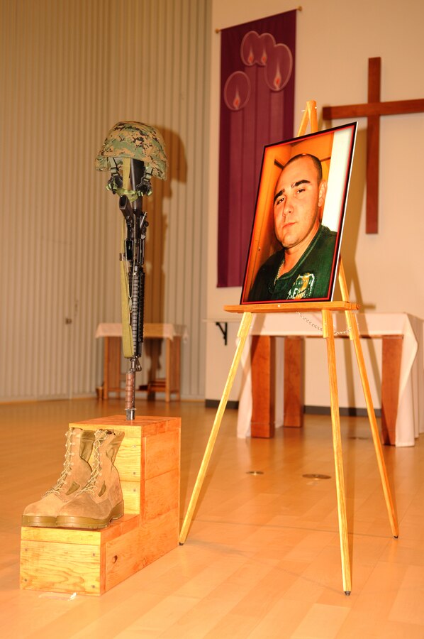 Sgt. Elvis Acosta, Marine Aviation Logistics Squadron 13 aviation supply technician, is remembered by fellow MALS-13 Marines during a memorial service at the Marine Corps Air Station in Yuma, Ariz., Dec. 3, 2010. The Tampa, Fla., native died in a motorcycle accident on Thanksgiving day. He is survived by his wife Alma and three children Melanie, Melissa and Elvis. Funeral services will be held at St. Mary Catholic Parrish in El Centro, Calif., Dec. 9, 2010.