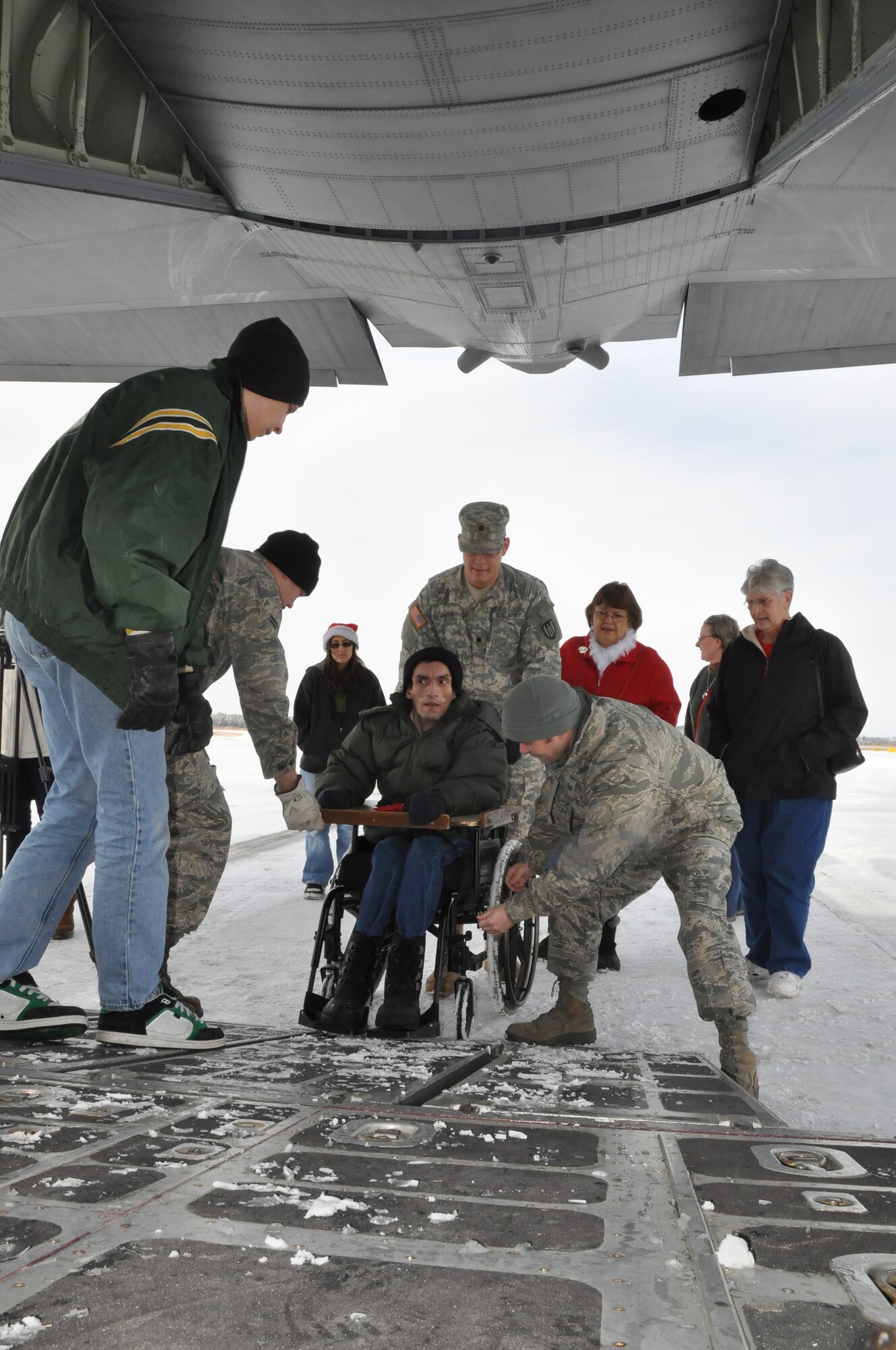 Special guests Board a 934th Airlift Wing C130 during Operation Santa Flight 2010, the 934th Airlift Wing along with volunteers from AT&T and the Army National Guard make it possible for people with special needs to get a trip to meet with Santa (Air Force Photo/Tech. Sgt. Bob Sommer)