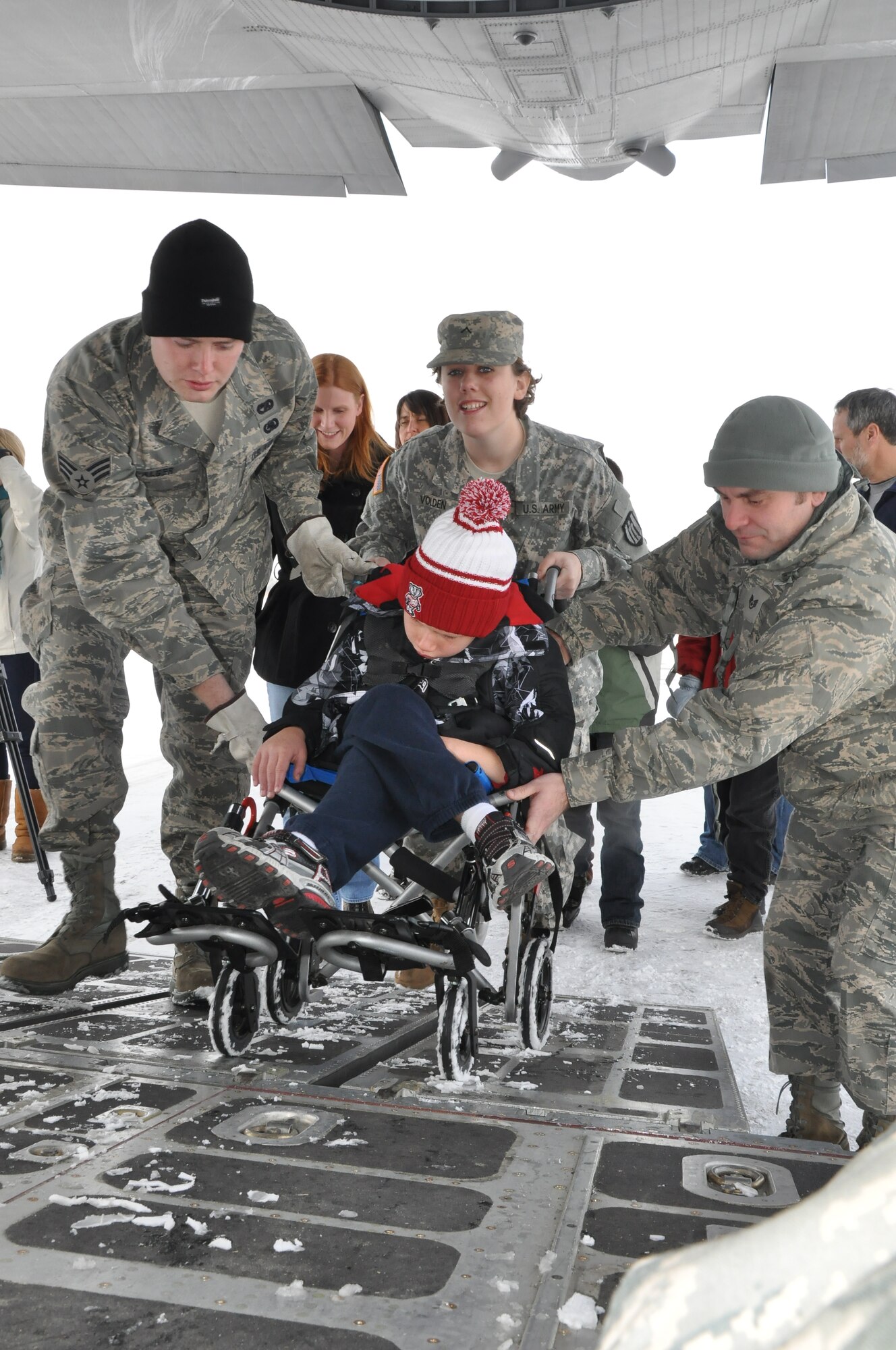 Special guests Board a 934th Airlift Wing C130 during Operation Santa Flight 2010, the 934th Airlift Wing along with volunteers from AT&T and the Army National Guard make it possible for people with special needs to get a trip to meet with Santa (Air Force Photo/Tech. Sgt. Bob Sommer)