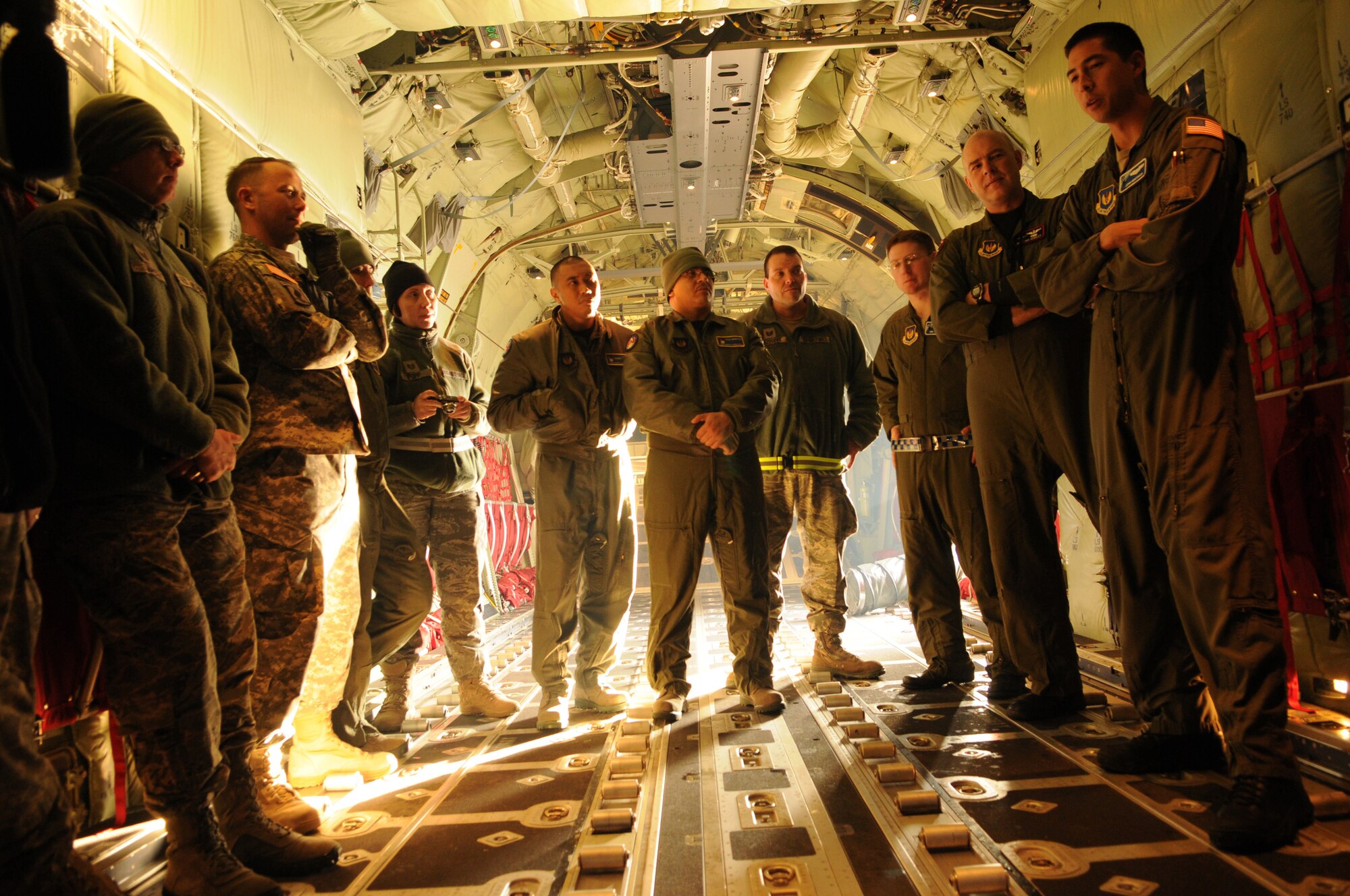RAMSTEIN AIR BASE, Germany -- Capt. John Huntsman (far right), 37th Airlift Wing aircraft commander, gives a preflight briefing to the crew and passengers of a C-130J Super Hercules before departing to support the response to wildfires near Haifa, Israel, Dec. 4. U.S. Air Forces in Europe is the lead component to airlift 20 tons of fire retardant to Israel for the U.S. European Command's support effort. EUCOM routinely provides foreign humanitarian assistance in response to crises in the region in the same manner as other regional partners. (U.S. Air Force photo/Staff Sgt. Benjamin Wilson)