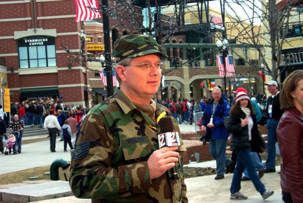 Tech. Sgt. Sterling Poulson, the Public Affairs Non-Commissioned Officer in Charge for Utah Air National Guard State Headquarters, gives a live weather report wearing his uniform during the 2002 Olympic Games in Salt Lake City. Sergeant Poulson is a traditional Air Guardsman as well as a local weatherman at KUTV 2News in Salt Lake City. U.S. Air Force courtesy photo (RELEASED).