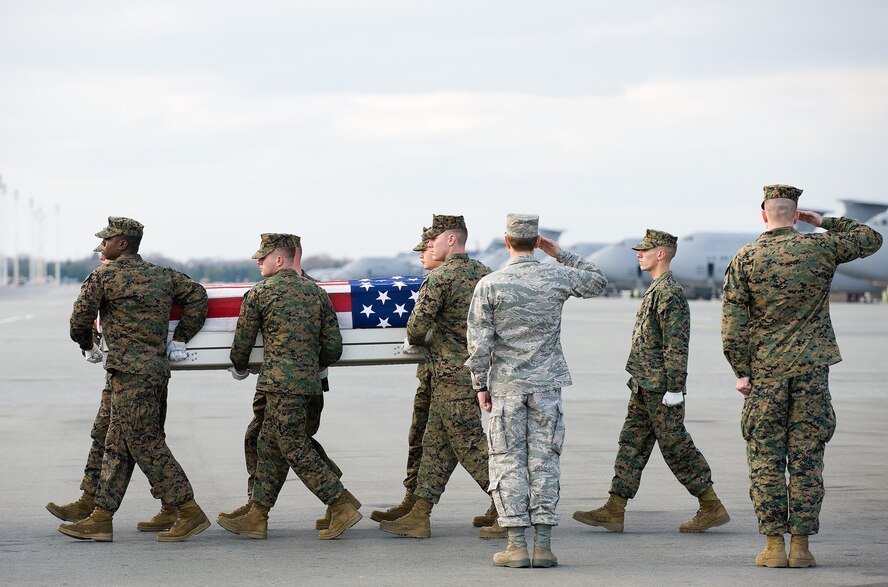A U.S. Marine Corps carry team transfers the remains of Marine Sgt. Matthew T. Abbate of Honolulu, Hawaii., at Dover Air Force Base, Del., Dec. 4, 2010.  Abbate was assigned to the 3rd Battalion, 5th Marine Regiment, 1st Marine Division, I Marine Expeditionary Force, Camp Pendleton, Calif. (U.S. Air Force photo by Jason Minto)
