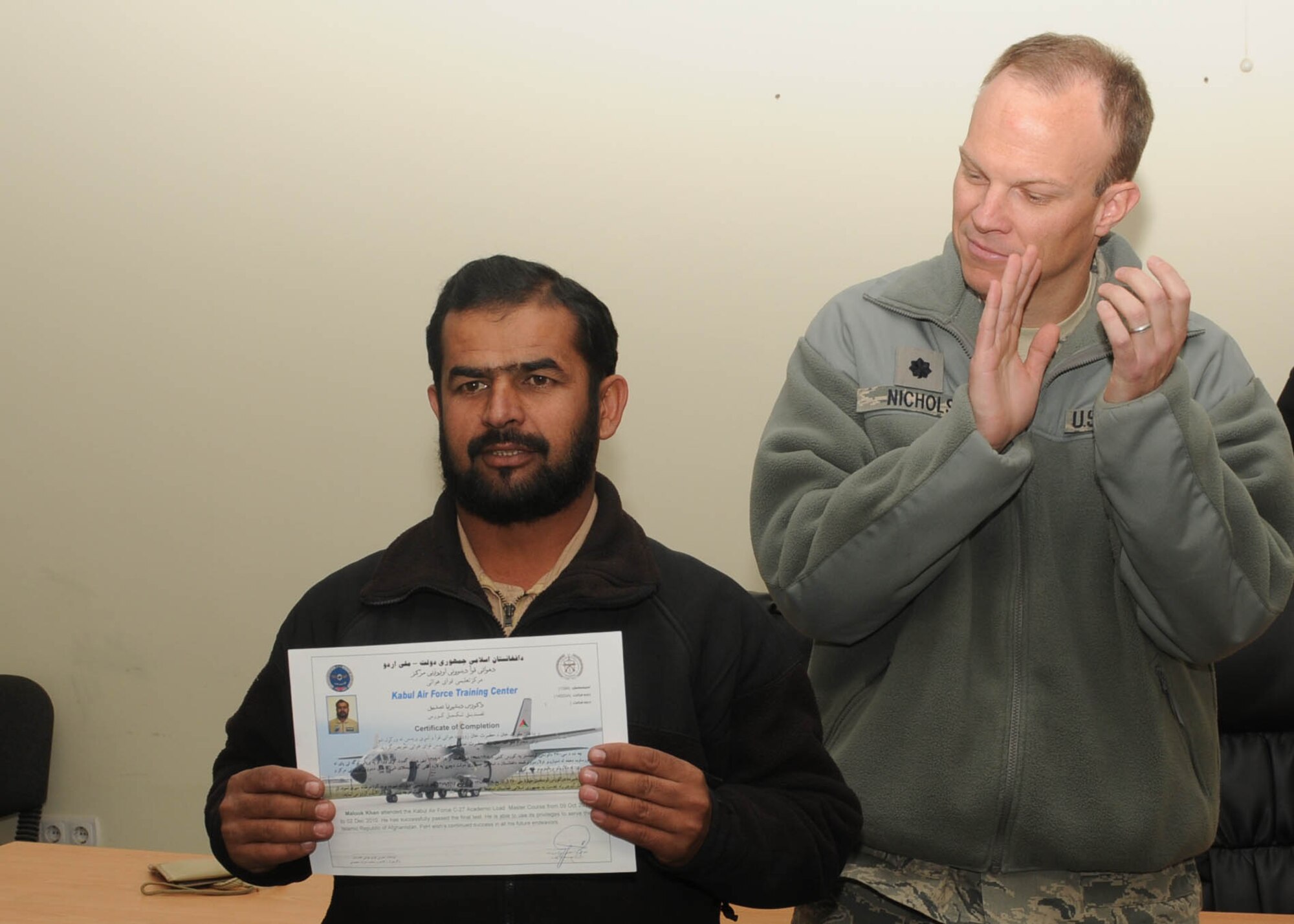 101204-N-6541W-005 KABUL, Afghanistan - Afghan Air Force Airmen graduate from the C-27 load master course at Pohantoon-e-Hawayee, the Afghan Air Force's "Big Air School" pose with Afghan Advisors on Dec. 4th.  (U.S. Navy photo by Mass Communication Specialist 3rd Class Jared Walker/ RELEASED).