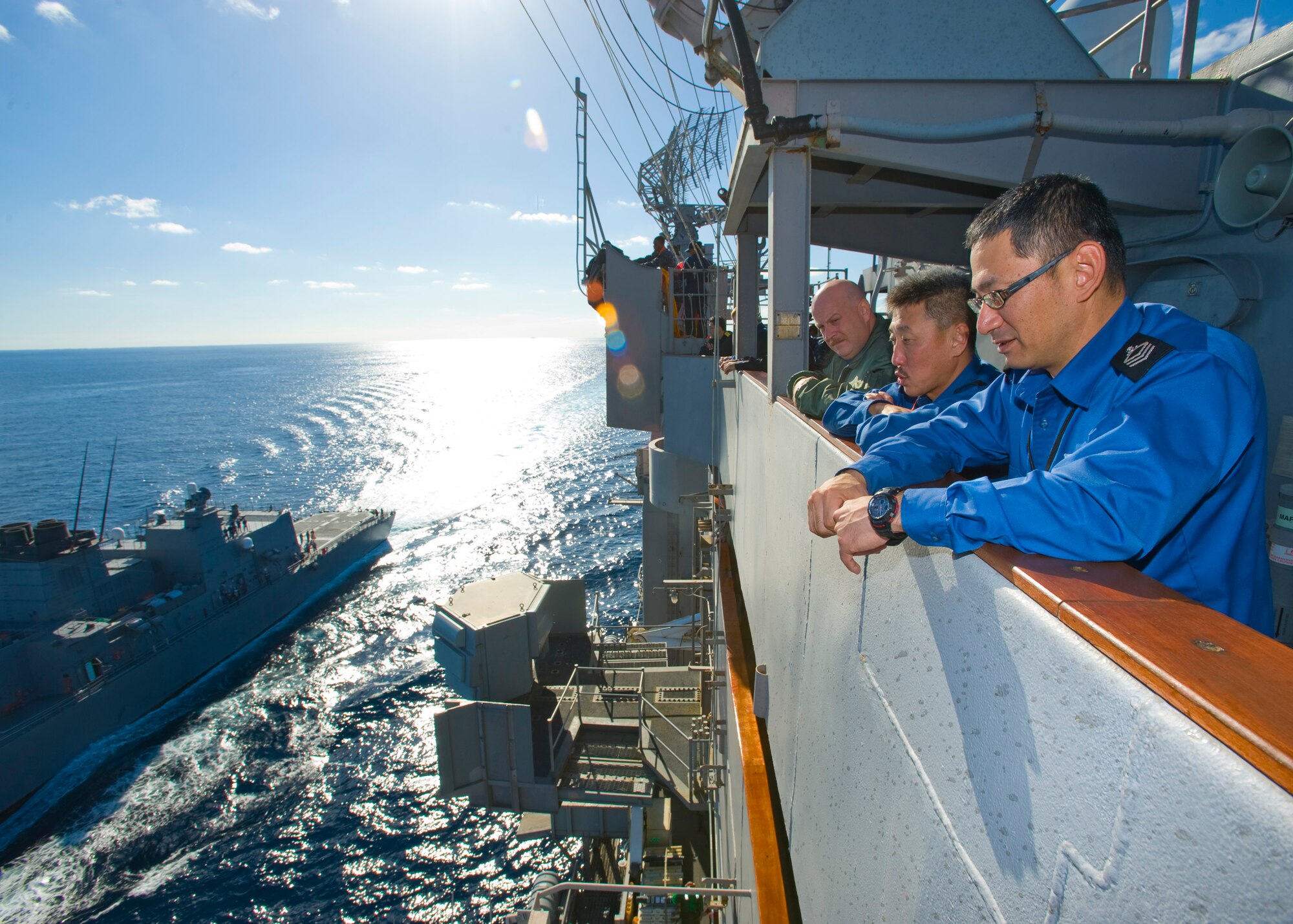 USS George Washington Command Master Chief Marty King (left), Japan Maritime Self Defense Force Force Master Chief Koji Himori (middle) and Escort Flotilla Command Master Chief Tanaka Naosuke (right) observe operations as JMSDF Escort Flotilla ship Ikazuchi steams into position along side USS George Washington during exercise Keen Sword in the Pacific Ocean, Dec. 5, 2010.  The exercise enhances the Japan-U.S. alliance which remains a key strategic relationship in the Northeast Asia Pacific region. Keen Sword caps the 50th anniversary of the Japan-U.S. alliance as an "alliance of equals." The exercise runs through Dec. 10. (U.S. Navy photo by Mass Communication Specialist 3rd Class Adam K. Thomas)