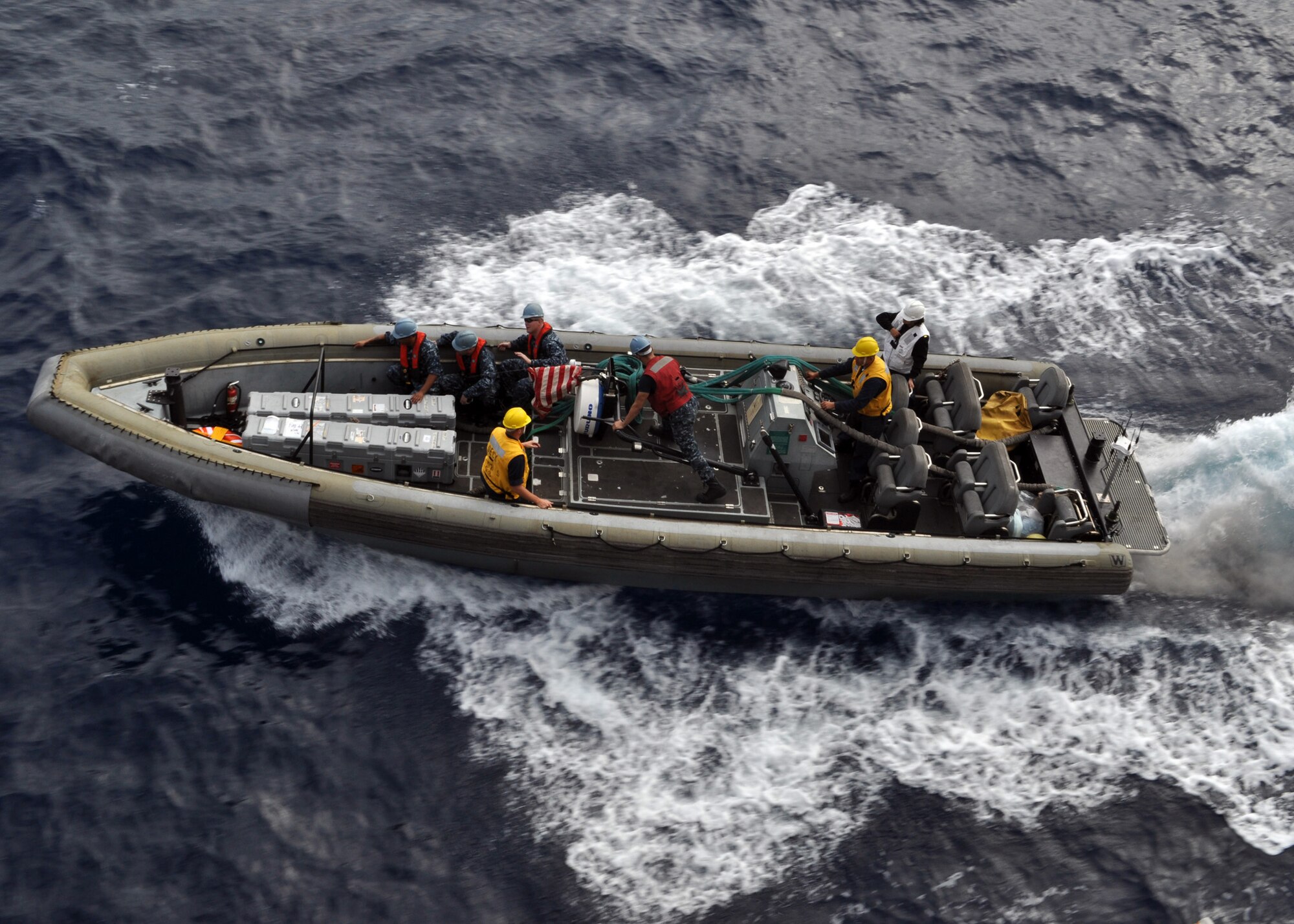 A rigid-hullinflatable boat (RHIB) launches from the amphibious transport dock USS
Denver (LPD 9) carrying two remote environmental monitoring units (REMUS
100) in the East China Sea on Dec. 5, 2010. The REMUS 100 is an unmanned undersea vehicle (UUV) that is used for mine detection. These operations mark the first ever launch of a UUV from an LPD-platform ship. Denver is part of the permanently forward-deployed Essex Amphibious Ready Group and is underway participating in Keen Sword 2011, a joint defense exercise with the Japan Maritime Self-Defense Force. (U.S.Navy photo by Mass Communication Specialist 3rd Class Bryan Blair)