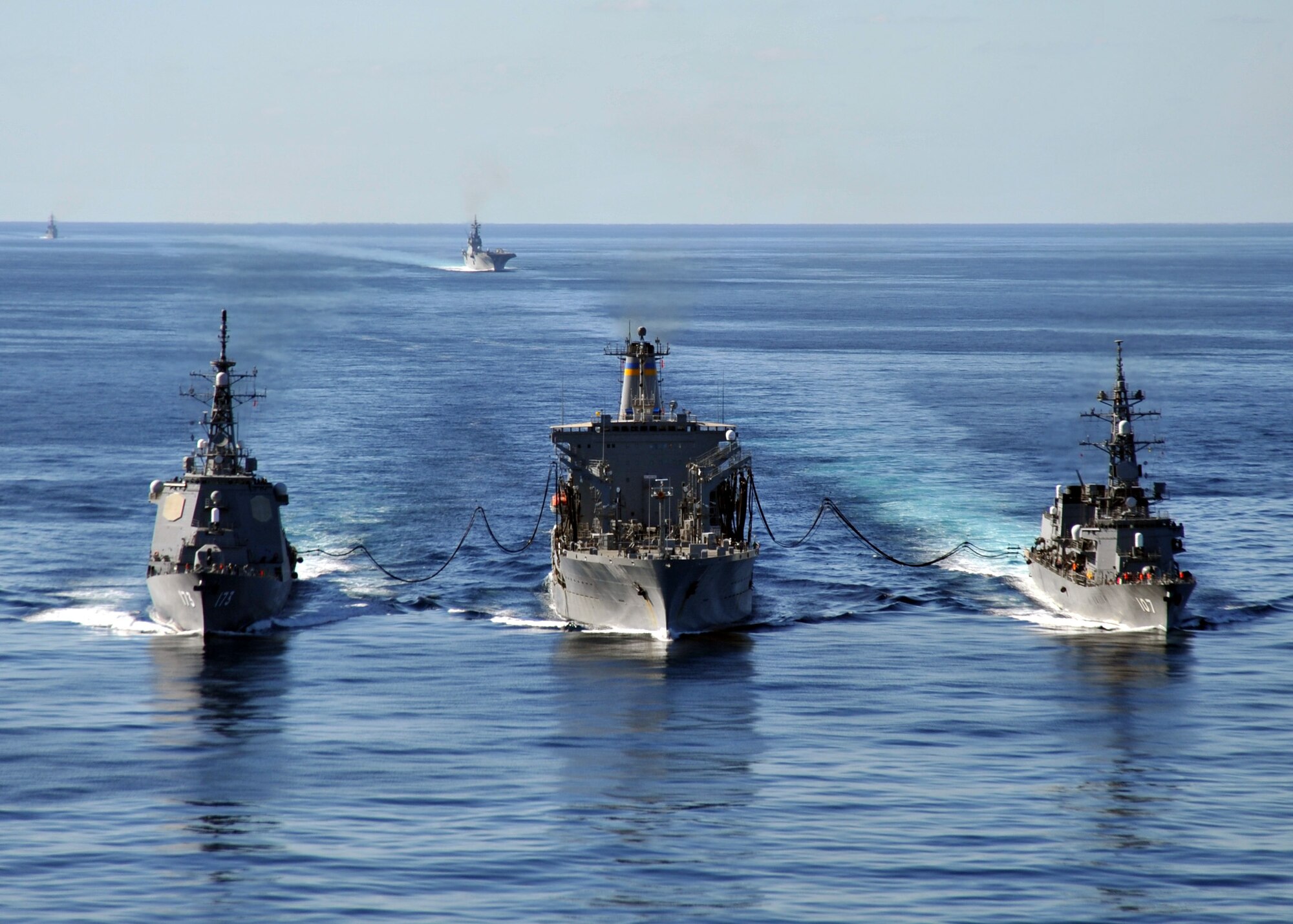 USNS Tippecanoe (T-AO 199) refuels Japan Maritime Self Defense Force Escort Flotilla ships Ikazuchi (DD-107) and  Kongo (DDG-173) as USS George Washington (CVN 73) steams behind in the Pacific Ocean on Dec. 5, 2010. GW is currently participating in Keen Sword 2011 with the Japan Maritime Self Defense Force (JMSDF). This exercise enhances the Japan-U.S. alliance which remains a key strategic relationship in the Northeast Asia Pacific region. Keen Sword caps the 50th anniversary of the Japan-U.S. alliance as an "alliance of equals." The exercise runs through Dec. 10. (U.S. Navy photo by Mass Communication Specialist 3rd Class Charles Oki)