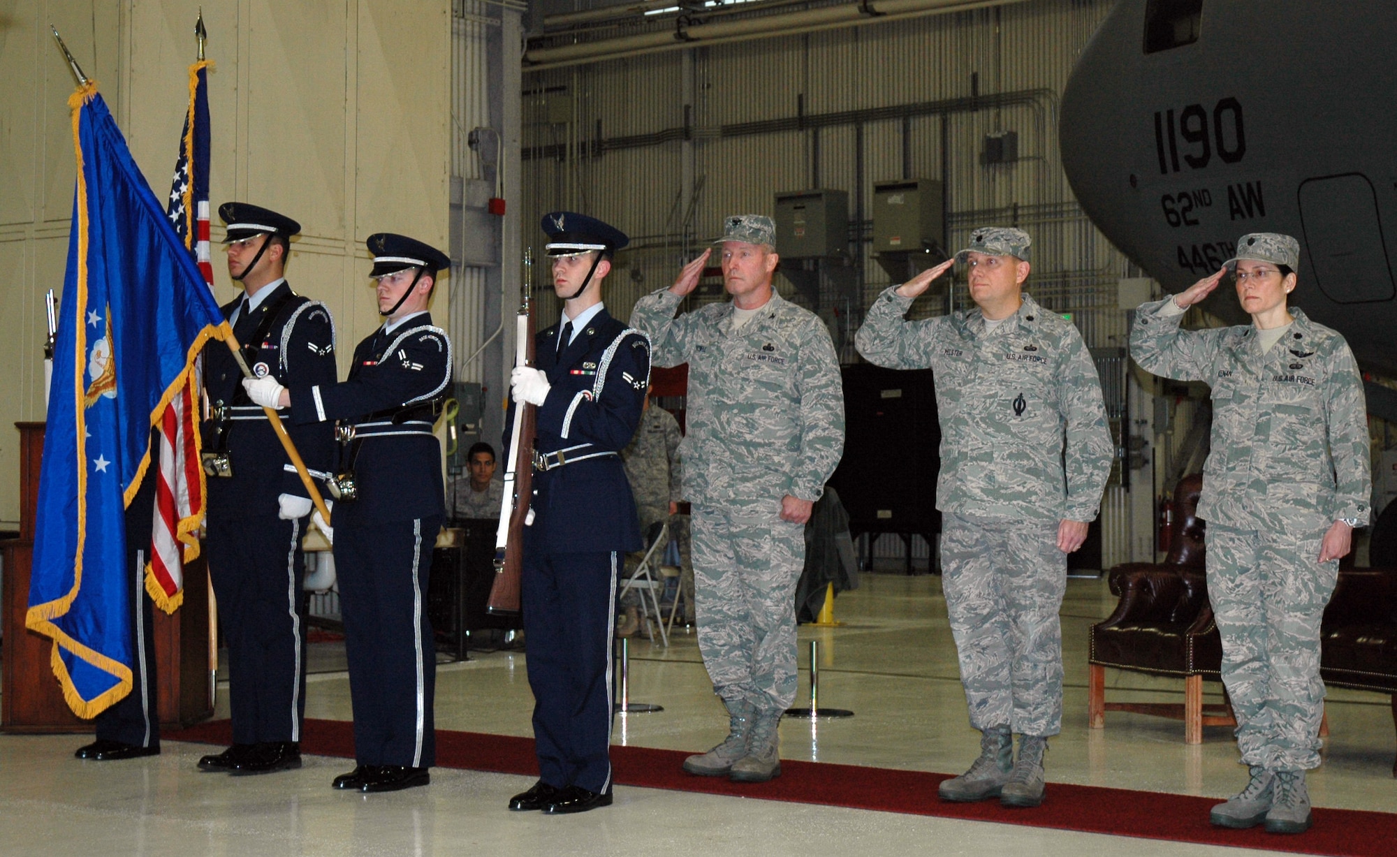 (From left to right) Members of the Honor Guard post the Colors, Col. Gerald Vowell, 446th Mission Support Group commander, Lt. Col. William Pelster, 446th Force Support Squadron commander, and Lt. Col. Patricia Keenan, 446th Services Flight, lead the 446th FSS activation ceremony on Dec. 5. The 446th Mission Support Squadron commanded by Colonel Pelster was deactivated and the 446th Services Flight commanded by Colonel Keenan was redesignated, combining both units to form the new 446th Force Support Squadron. (U.S. Air Force photo/Staff Sgt. Elizabeth Moody)