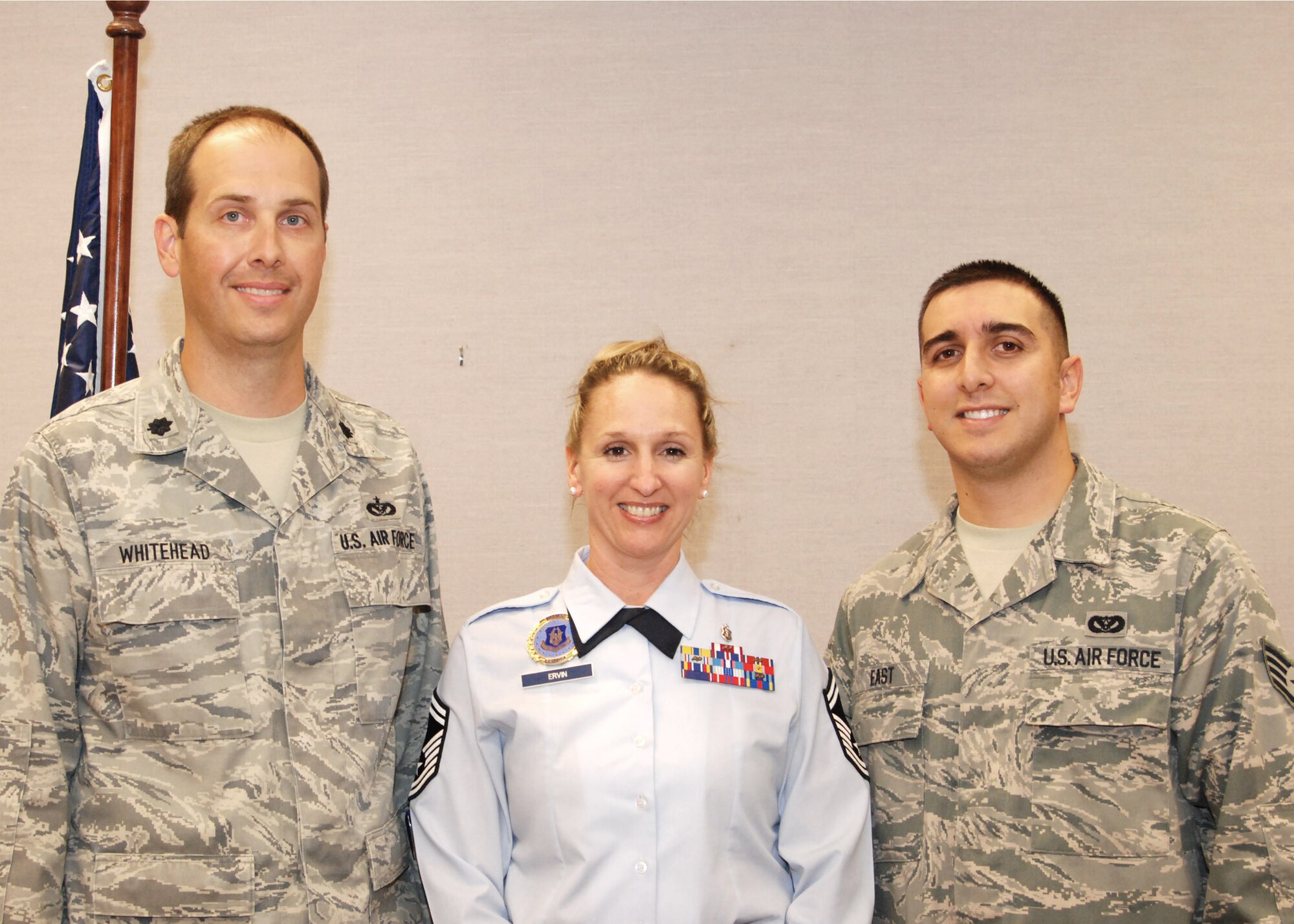 Senior Master Sgt. Kristyn Ervin, 94th Airlift Wing senior recruiter, was invited by Staff Sgt. Joseph East, 94th Civil Engineer Squadron  pavements maintenance and heavy equipment operator,  and  Lt. Col. Christopher Whitehead, 94th CES commander,  to attend the first reenlistment of Sergeant East Dec. 4.  Sergeant Ervin recruited Sergeant East six years ago in Hawaii.   (U.S. Air Force photo/Master Sgt. Stan Coleman)  