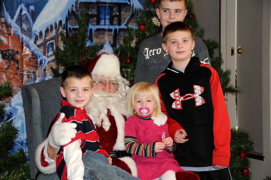 From left, Dominic, Payton, Colby, and Noah East, children of Tech. Sgt. Ryan East, pose for a picture with Santa at the Santa House.  Airmen of the 185th Air Refueling Wing, Iowa Air National Guard, volunteered   at the Santa House on December 5th, 2010, in Sioux City, Iowa. 
Air Force Photo by: Tech. Sgt.  Oscar M. Sanchez


Air Force Photo by: Tech. Sgt.  Oscar M. Sanchez

