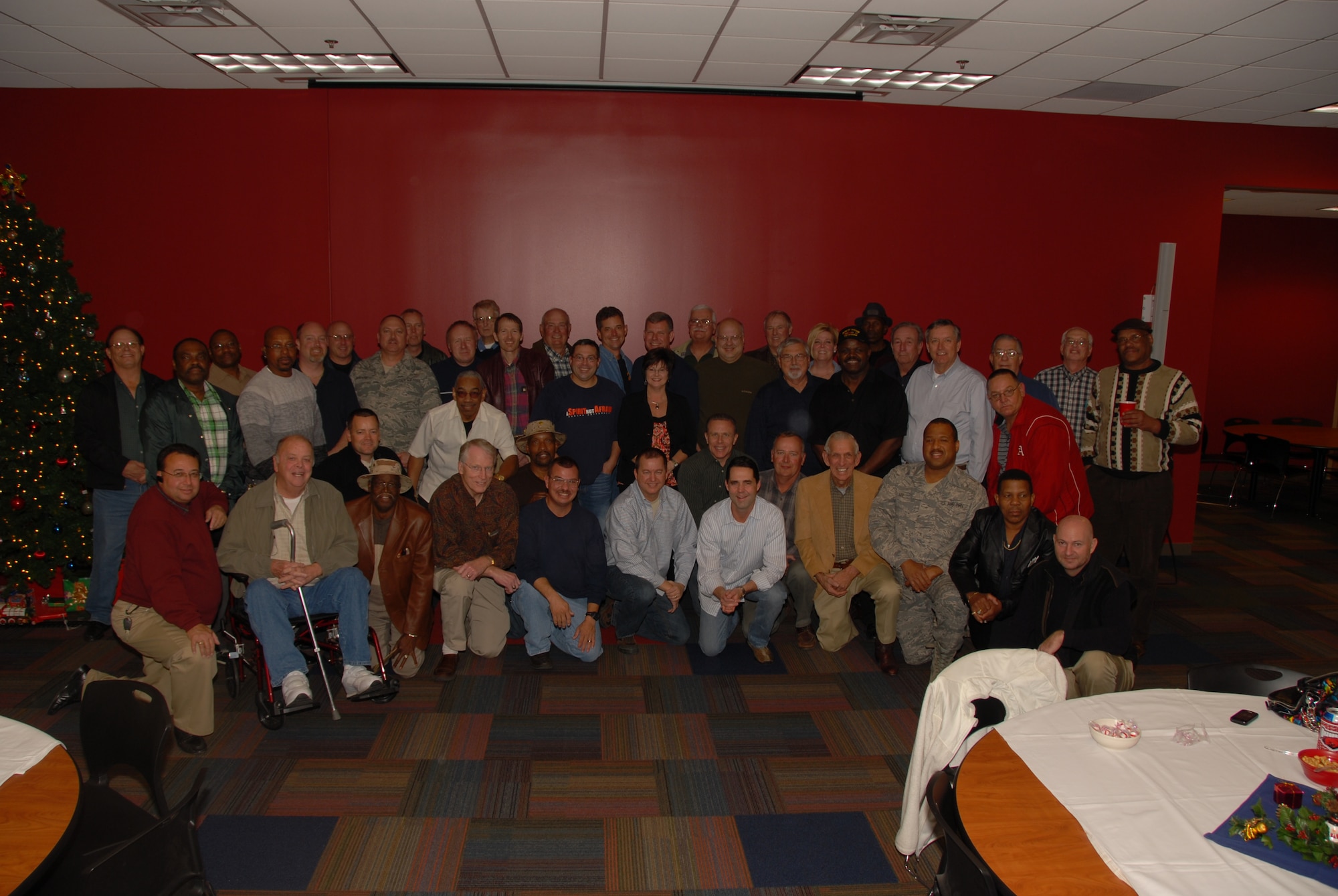 Former members of the 164th Aerial Port Squadron pose for a group picture during their 20 year Desert Storm Deployment Reunion.