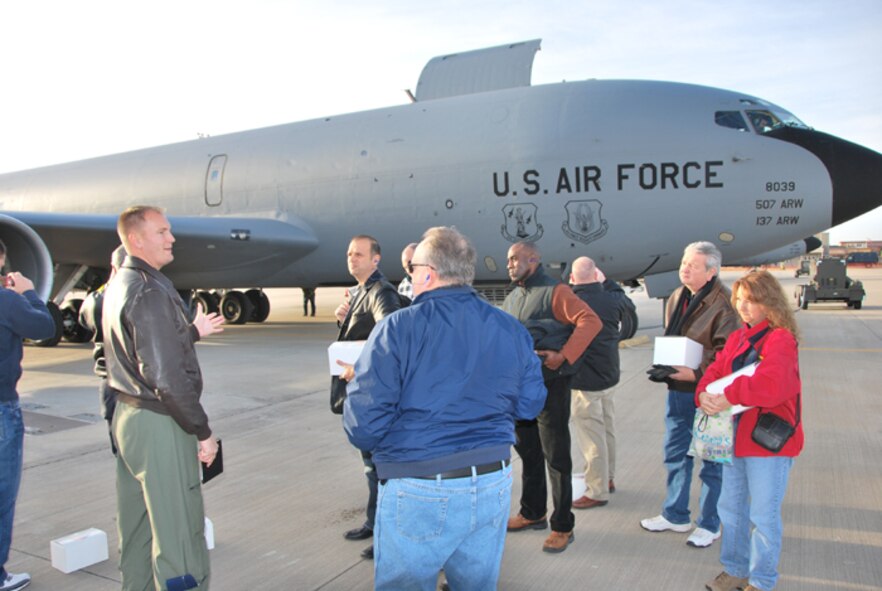 Capt Ben Yoder, a pilot with the 465th Air Refueling Squadron, toured community employers around KC-135R aircraft explaining the mission and answering questions prior to boarding a employer support flight on Dec. 3rd. 