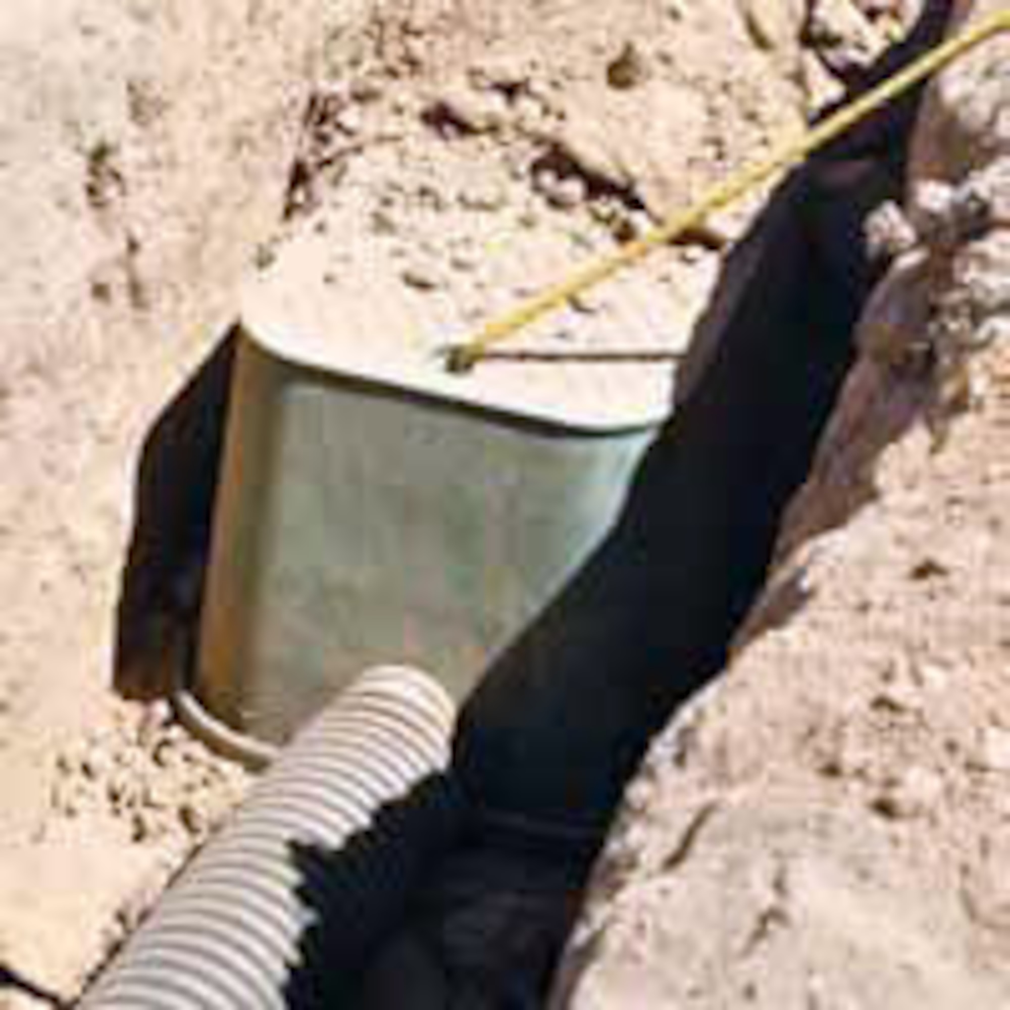 Burying the nest box.  (U.S. Air Force photo by Megan Just)
