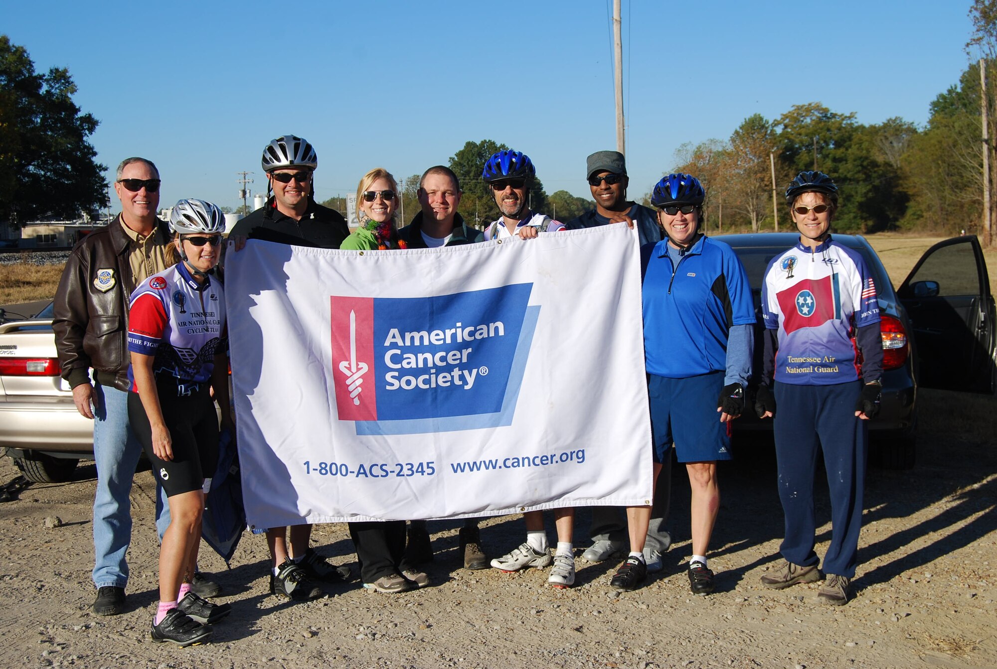 Col Harry Montgomery and members of the 164th Airlift Wing Bike Team pose during the First Annual Sherry Boyer Simmons Memorial Bike Ride.