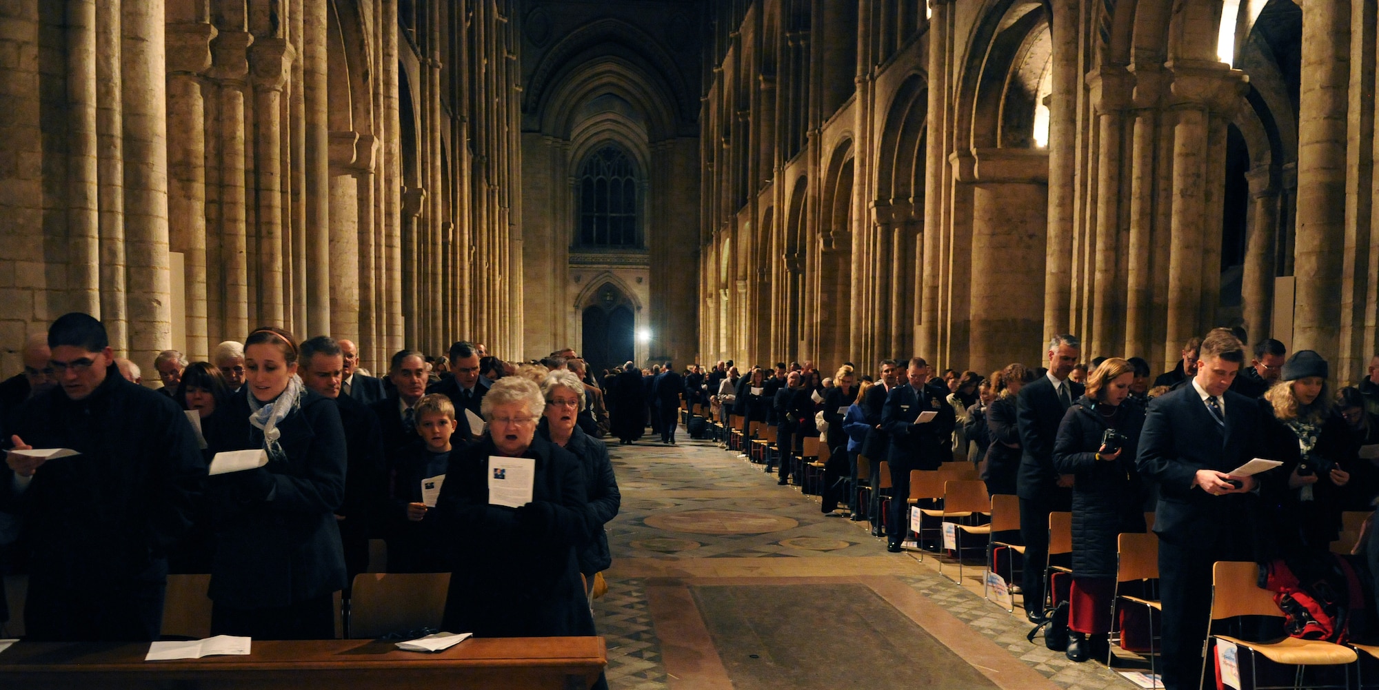 RAF MILDENHALL, England -- American servicemembers, their families and other employees of RAFs Mildenhall and Lakenheath sing at Ely Cathedral on the eve of Thanksgiving Nov. 24, 2010. The 24th Annual Thanksgiving Service gave U.S. servicemembers in England an opportunity to enjoy a holiday service at one of the cathedrals in the local area. (U.S. Air Force photo/Staff Sgt. Thomas Trower)