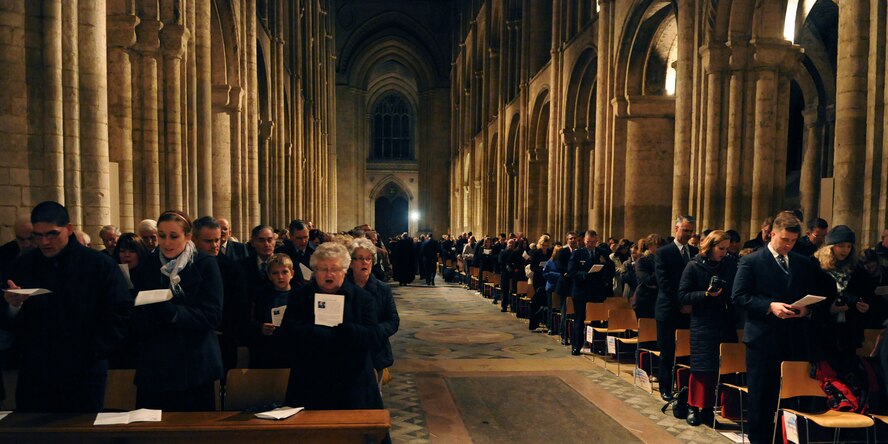 RAF MILDENHALL, England -- American servicemembers, their families and other employees of RAFs Mildenhall and Lakenheath sing at Ely Cathedral on the eve of Thanksgiving Nov. 24, 2010. The 24th Annual Thanksgiving Service gave U.S. servicemembers in England an opportunity to enjoy a holiday service at one of the cathedrals in the local area. (U.S. Air Force photo/Staff Sgt. Thomas Trower)