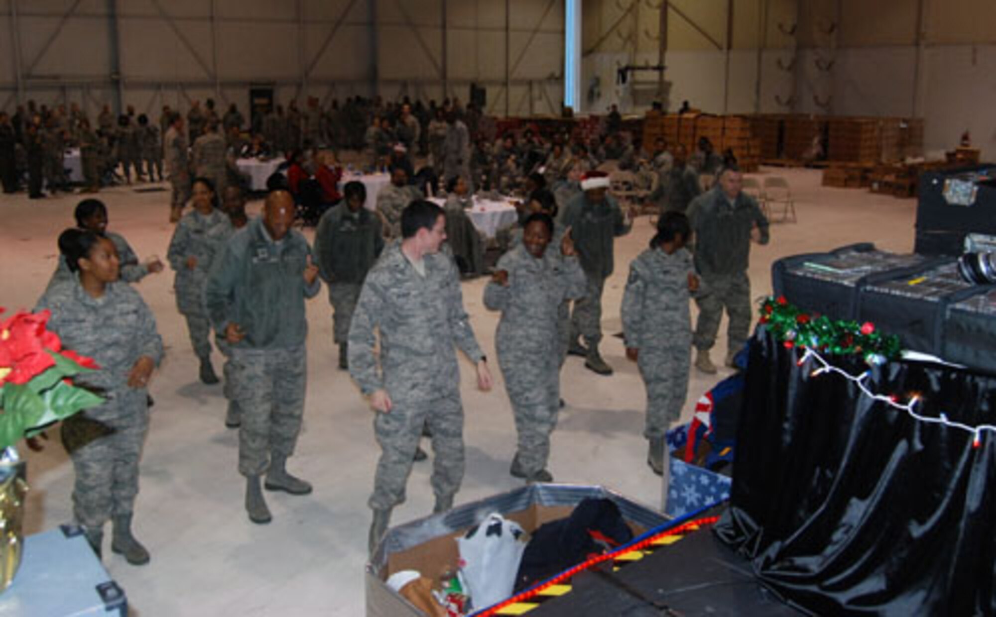 Citizen Airmen of the 94th Airlift Wing gathered at the Human Resources Development Council sponsored Holiday Party at Hangar 5 here Dec. 4. Airmen danced to several songs during this fun time together. (U.S. Air Force photo/ Senior Airman Danielle Campbell)