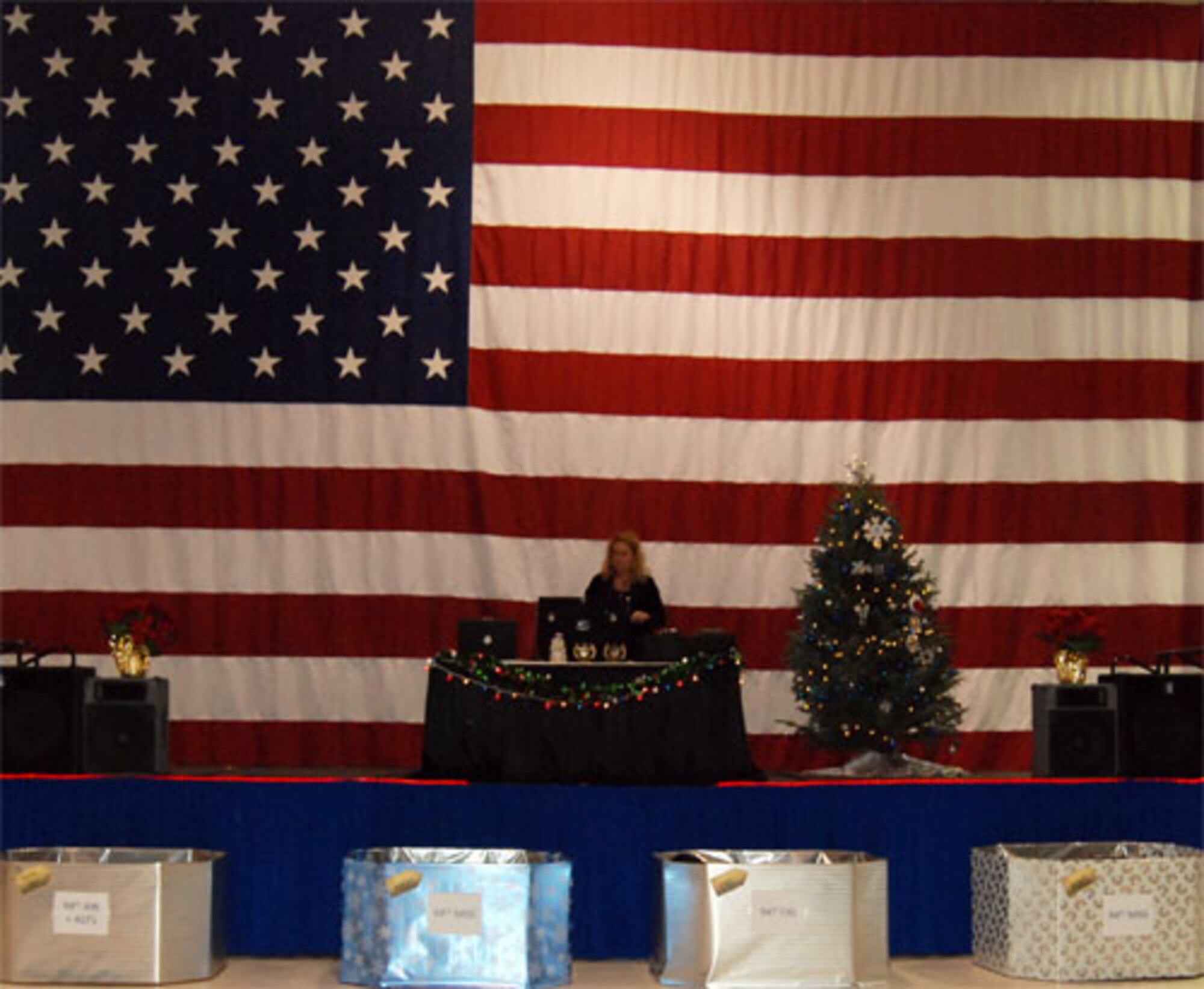Citizen Airmen of the 94th Airlift Wing gathered at the Human Resources Development Council sponsored Holiday Party at Hangar 5 here Dec. 4. Units competed for the “Annual holiday giving back trophy” by donating coats and non-perishable food items.  