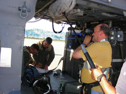 DAVIS-MONTHAN AIR FORCE BASE, Fla. - Air Force Reserve Combat-Search-and Rescue (CSAR) Airmen are featured for their heroics in a newly released documentary titled, "The Taliban Gambit," which will be airing on the Smithsonian Channel throughout December 2010.  Here the film team, captures Lt. Col. Jeffrey "Spanky" Peterson, prior to a high-altitude mission in the Tuscon desert. Lt. Colonel Peterson, was the lead Pave Hawk CSAR pilot at the time. He is now the CSAR/personal recovery program manager for Air Force Reserve Command and the Air National Guard at the ANG/AFRC Test Center, Tucson, Ariz. (U.S. Air Force photo/Capt. Cathleen Snow)
