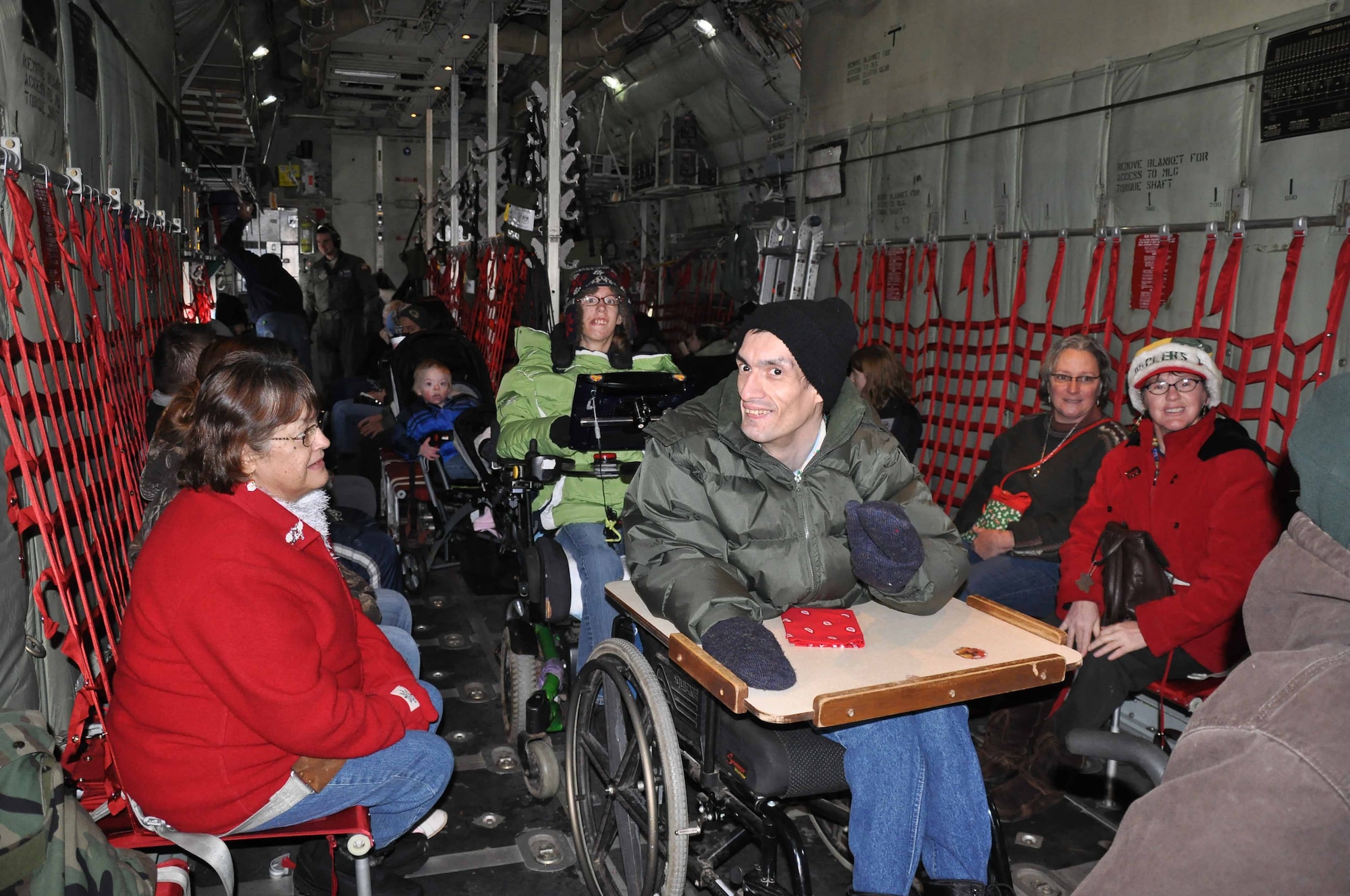 Special guests "flying" to the North Pole on a 934th Airlift Wing C130 during Operation Santa Flight 2010, the 934th Airlift Wing along with volunteers from AT&T and the Army National Guard make it possible for people with special needs to get a trip to meet with Santa (Air Force Photo/Tech. Sgt. Bob Sommer)