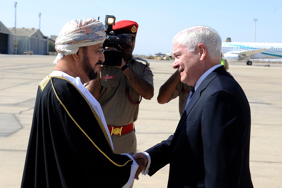 Omani Defense Affairs Minister Sayyid Badr bin Saud bin Harib al-Busaidi greets U.S. Defense Secretary Robert M. Gates during the secretary's arrival in Muscat, Oman, Dec. 5, 2010. 