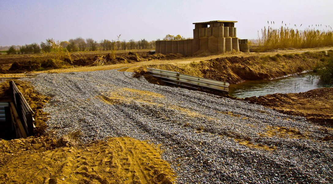 Marines with Engineer Company, Combat Logistics Battalion 3, 1st Marine Logistics Group (Forward) finshed construction of a bridge and guard post in Marjah, Afghanistan, Dec. 5. Combat engineers with CLB-3 conducted operations in direct support of Marine units operating in the area.