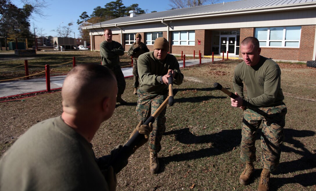 Sergeant Deryl B. Stockton (right), 27, Unit Movement Coordinator Non Commissioned Officer at Combat Logistics Regiment 2, 2nd Marine Logistics Group, conducts Marine Corps martial arts training, Dec. 6, 2010, aboard Camp Lejeune, N.C. Stockton has participated in three combat tours with 2nd MLG and is preparing to transfer to Marine Corps Logistics Base Albany, Ga.