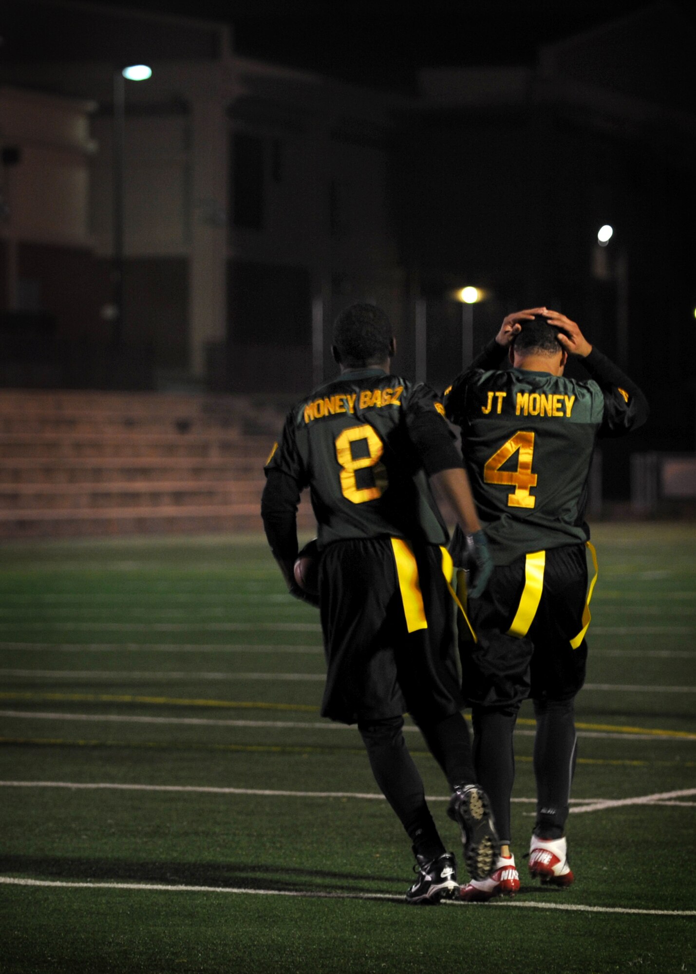 51st Force Support Squadron football players react after a missed catch during the base flag football intramural championship Dec. 6 at Osan Air Base, Republic of Korea. The 51st FSS team took home the trophy with a 26-14 victory over the 51st Aircraft Maintenance Squadron. (U.S. Air Force photo/Senior Airman Evelyn Chavez)