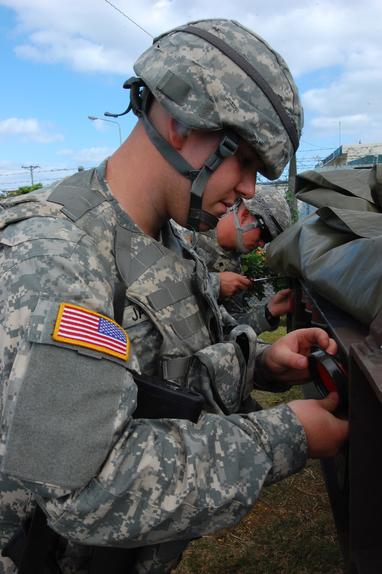 (From left to right) Pvt. Matthew Jacewicz, a command control technician, and Spc.  Shane Stone, an enhanced patriot operator and maintainer with the U.S. Army, perform maintenance on a picture system radar during the Keen Sword exercise at Camp Courtney Dec. 4. Exercises such as Keen Sword provide an indispensable field training environment for enhancing mutual understanding of each country's tactics, communication protocols, procedures, and general interoperability. (U.S. Air Force photo/ Staff Sgt. Lakisha Croley)