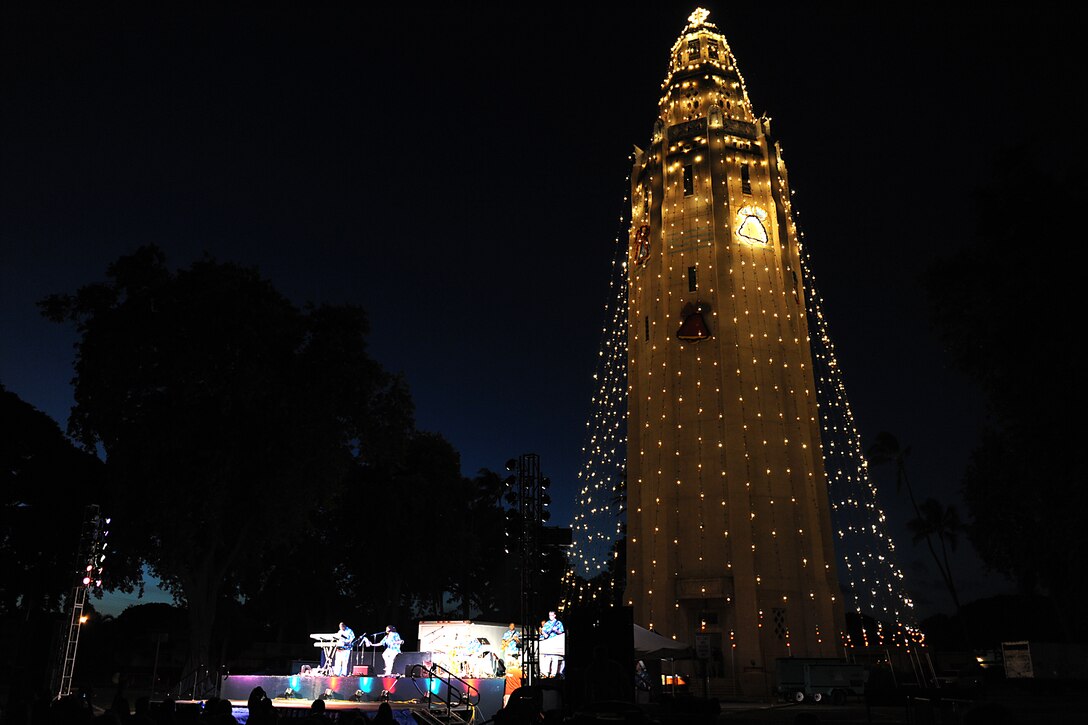 The Freedom Tower, standing at 171 feet, shines brigtly during the 41st Annual Freedom Tower Lighting Ceremony Dec. 3. Joint Base Pearl Harbor Hickam Airmen, Soldiers, Sailors and Marines were treated to a night of Christmas music performed by Pacific Air Forces Band of the Pacific, Hana Hou. The tower was built under the direction of Capt. Howard B. Nurse of the U.S. Army's Quartermaster Corps, at a cost of $43,146.60, and it was completed Jan. 14, 1938.  (U.S. Air Force photo/Staff Sgt. Mike Meares)    