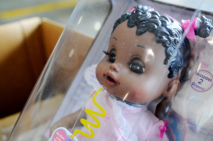 More than 57 boxes are filled with toys, cloths, first aid kits, food and supplies Dec. 4, 2010 at Andersen Air Force Base, Guam, during the Operation Christmas Drop box build. Christmas Drop is the longest running humanitarian campaign in the world marking more than five decades in operation. The concept of Operation Christmas Drop began in 1952 when locals on the island of Kapingamarangi waved to the crew of a WB-50 flying overhead. In the spirit of the holiday season, the crew gathered what they could, packed it into a canister, attached a parachute and dropped it to the islanders. (U.S. Air Force photo/ Senior Airman Nichelle Anderson)