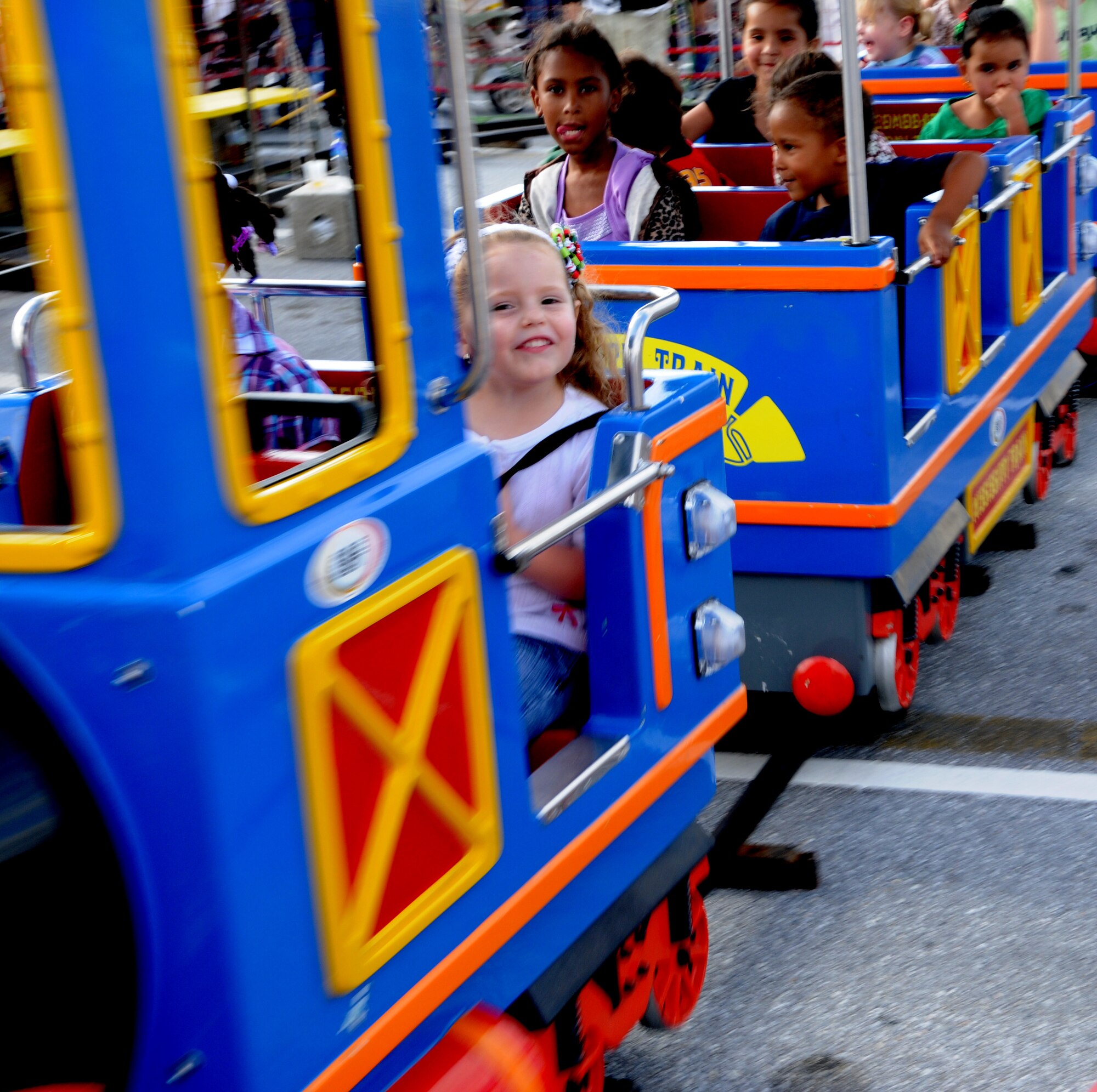 Children ride the train at Tinsel Town  on Kadena Air Base, Dec 4. Tinsel Town attractions for children included bouncers, a merry-go-round and a train ride. (U.S. Air Force photo/Airman 1st Class Jarvie Z. Wallace)