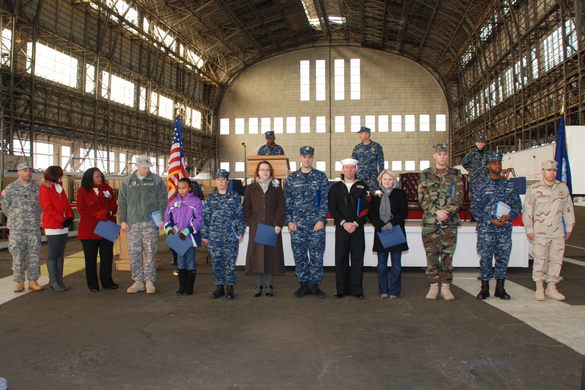 More than 250 guests from Joint Base McGuire-Dix-Lakehurst and the local community honored 13 Sailors from the joint base who returned home from a deployment within the last year. The Sailors were presented awards while their family received a certificate of appreciation for the support. (U.S. Navy photo/Sherry Jacob)