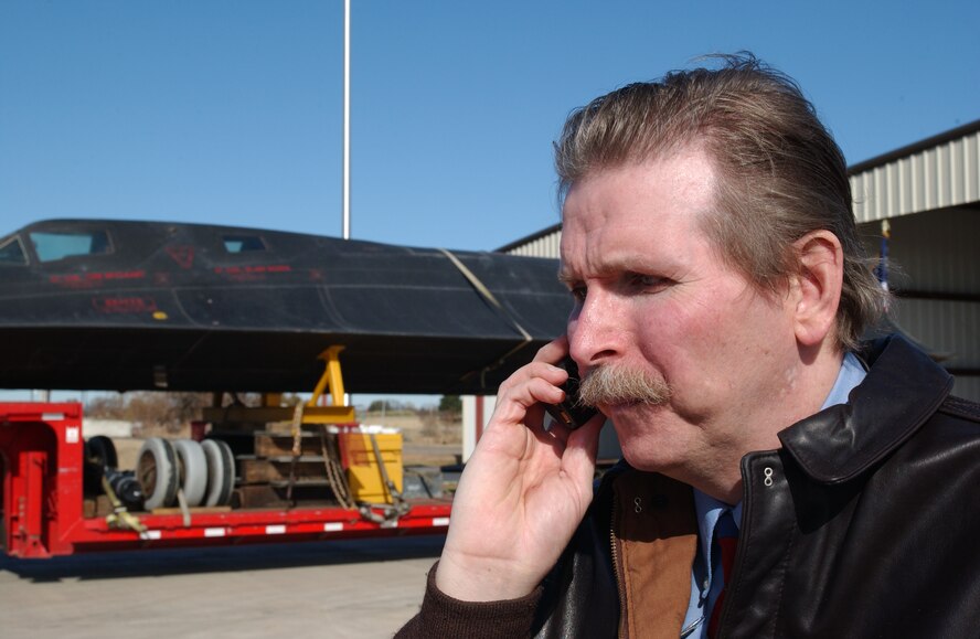 Harold D. "Buck" Rigg, director 8th Air Force Museum, coordinates withe the 2nd Security Forces Squadron to escort the newly acquired SR-71 on Dec 11, 2003 to it's final resting place at the Eighth Air Force Museum. The SR-71 was reassembled and dedicated on Dec 17, 2003 which was the 100th anniversary of the first flight by Orville and Wilbur Wright at Kitty Hawk, NC. (U.S. Air Force photo/Master Sgt. Mike Kaplan)