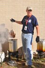 LAUGHLIN AIR FORCE BASE, Texas — Chief Master Sgt. Mike Hanning, 47th Flying Training Wing command chief, fries a turkey at the 21st Annual Del Rio Wild Game Dinner Saturday, Dec. 4. The dinner is one of the largest events the Del Rio Chamber of Commerce hosts annually.  (U.S. Air Force Photo by Joel Langton)