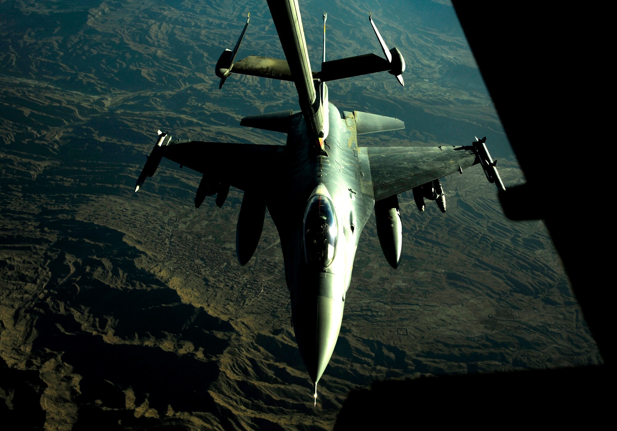 A KC-10 Extender aircraft assigned to the 908th Expeditionary Air Refueling Squadron, supplies fuel to an F-16 Fighting Falcon over the mountains of Afghanistan in support of Operation Enduring Freedom during an air refueling mission Nov. 25, 2010. The 908th EARS is part of the 380th Air Expeditionary Wing at a non-disclosed base in Southwest Asia. (U.S. Air Force Photo/Staff Sgt. Andy M. Kin)