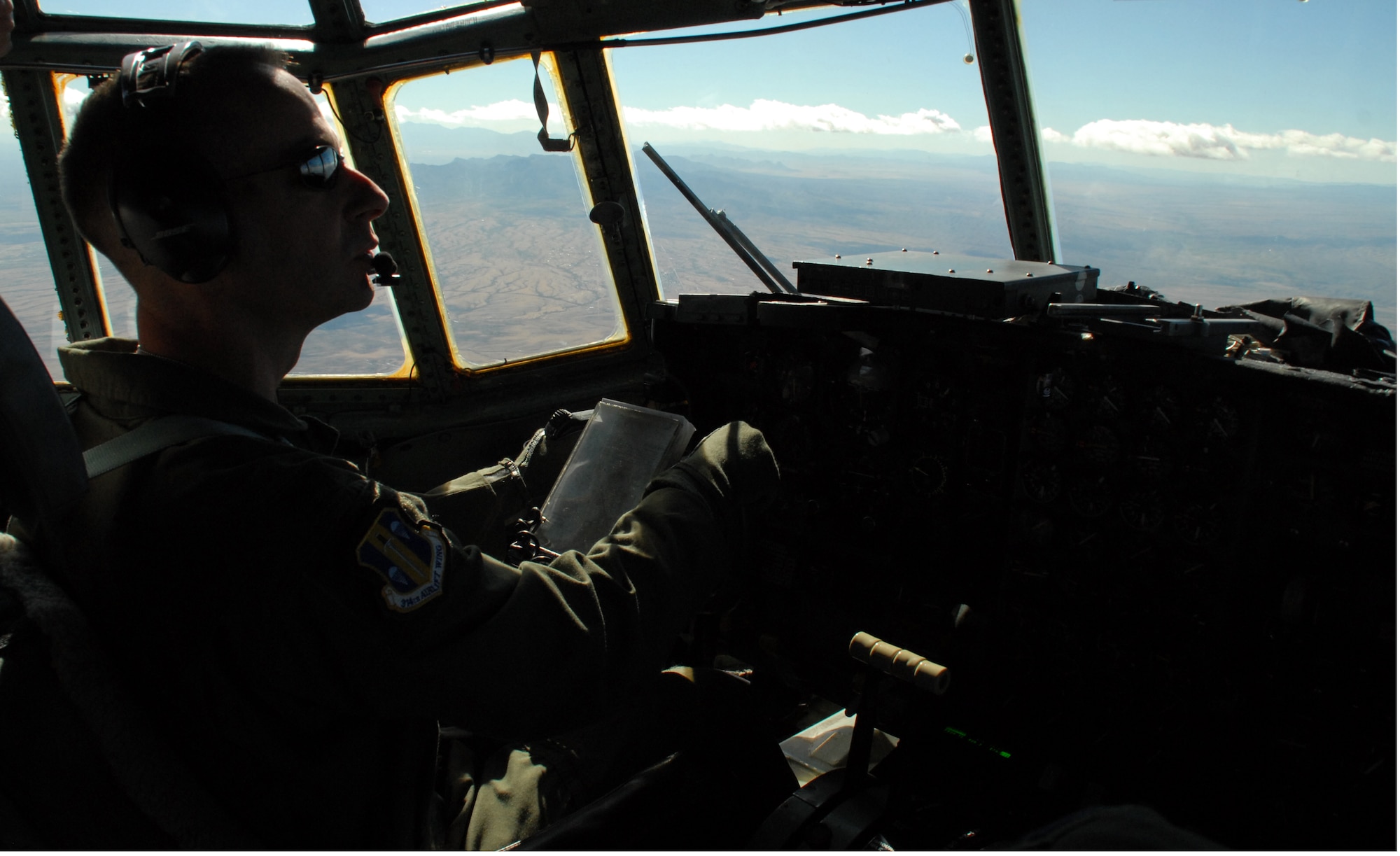 Col. Mark Czelusta, 314th Airlift Wing commander, flies Little Rock Air Force Base C-130E aircraft 62-1788 during its retirement flight to Davis-Monthan Air Force Base's 309th Aerospace Maintenance and Regeneration Group in Arizona Nov. 29, 2010.  Aircraft 62-1788 was retired as part of a strategic Air Force effort to modernize its C-130 fleet with C-130J and C-130H AMP aircraft to meet the needs of today's warfighters in a more efficient, cost-effective way. Colonel Czelusta was the aircraft commander for the flight. (U.S. Air Force photo by Capt. Joe Knable)