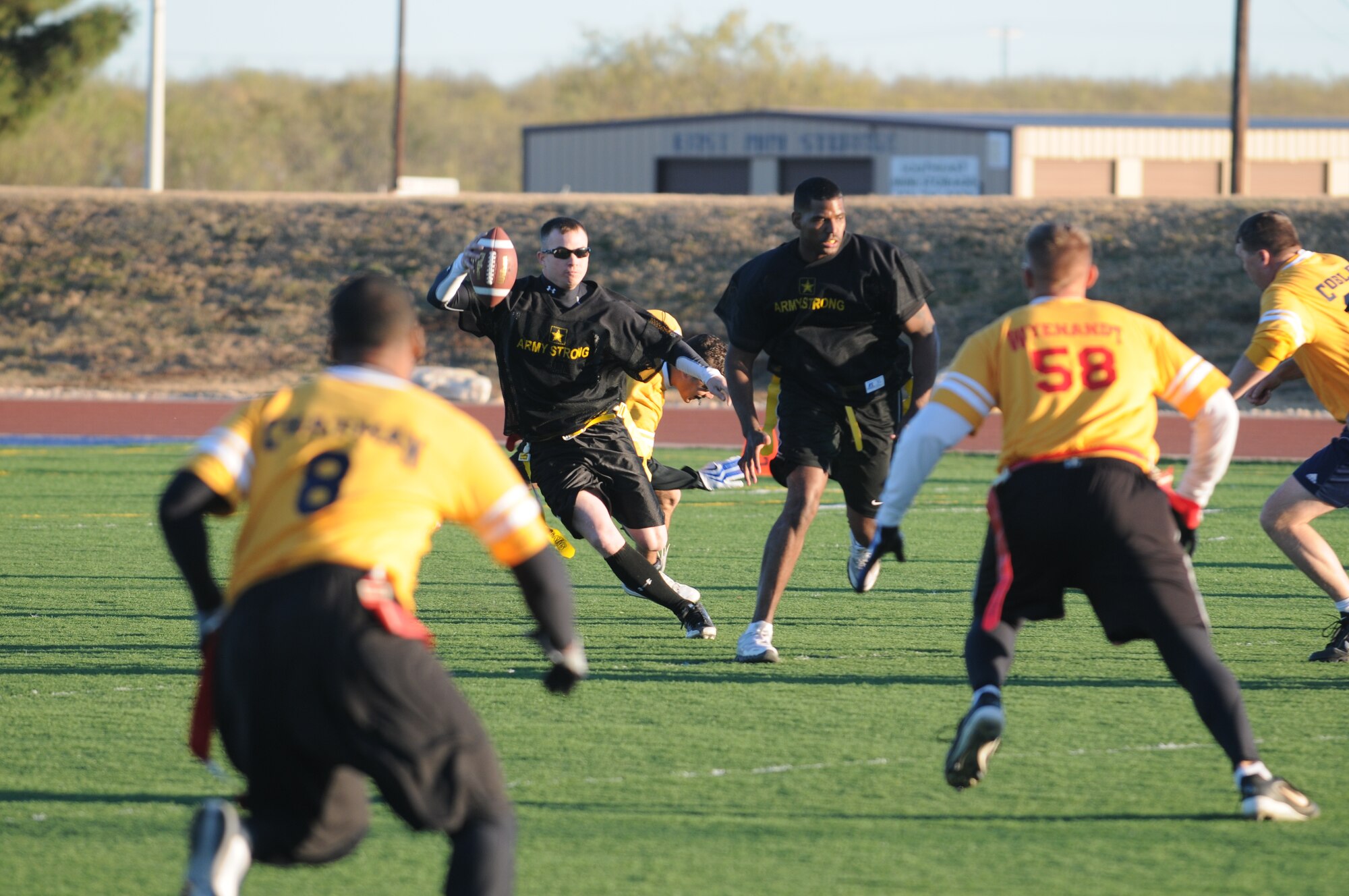 GOODFELLOW AIR FORCE BASE, Texas -- Army quarterback Christopher Guy looks down field for a pass during the annual Army/Navy Flag Football Game Dec. 1.  Army took the championship: 28-12.  (U.S. Air Force Photo/Airman 1st Class Clayton Lenhardt)