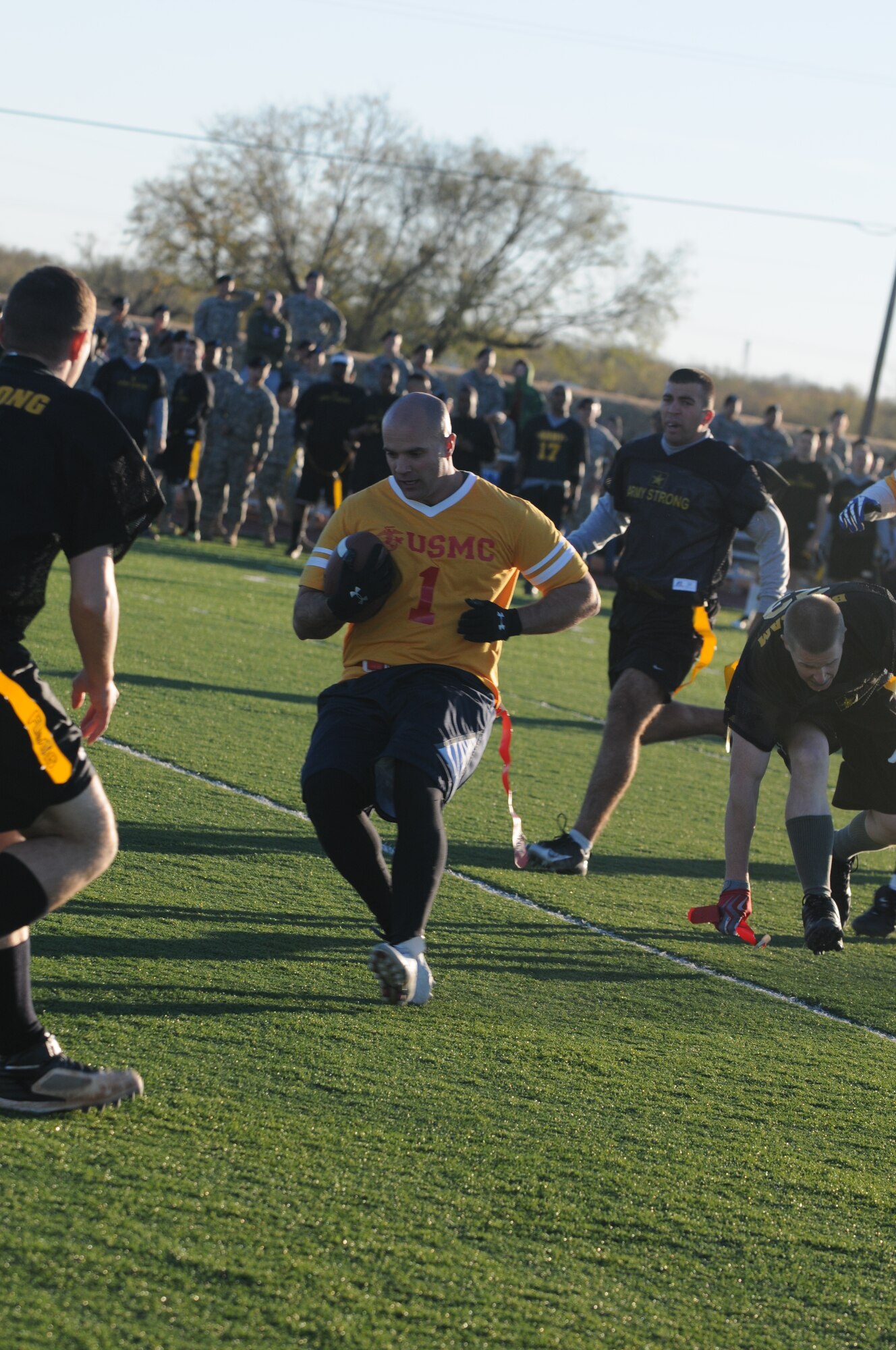 GOODFELLOW AIR FORCE BASE, Texas -- While trying to run the ball, Navy player Benjamin Clark gets his flag pulled during the Army/Navy Flag Football Game Dec. 1.  The Army defeated the Navy during the annual challenge: 28-12.  (U.S. Air Force Photo/Airman 1st Class Clayton Lenhardt)
